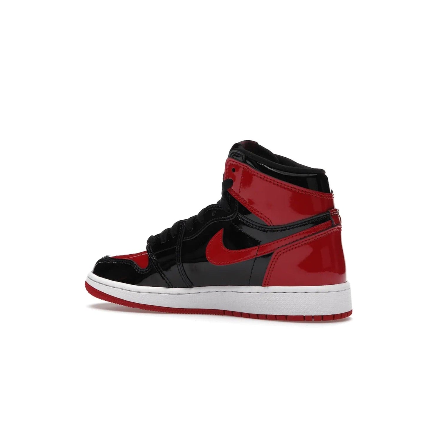 Jordan 1 Retro High OG Patent Bred (GS) - Image 22 - Only at www.BallersClubKickz.com - Upgrade your sneaker game with the iconic Air Jordan 1 Retro High OG Bred Patent GS. Crafted with premium patent leather and basketball-inspired details for a classic look, they also feature an encapsulated Air-sole cushioning and enhanced red rubber outsole. Don't miss this timeless sneaker with a striking black, white, and varsity red colorway, dropping December 2021.