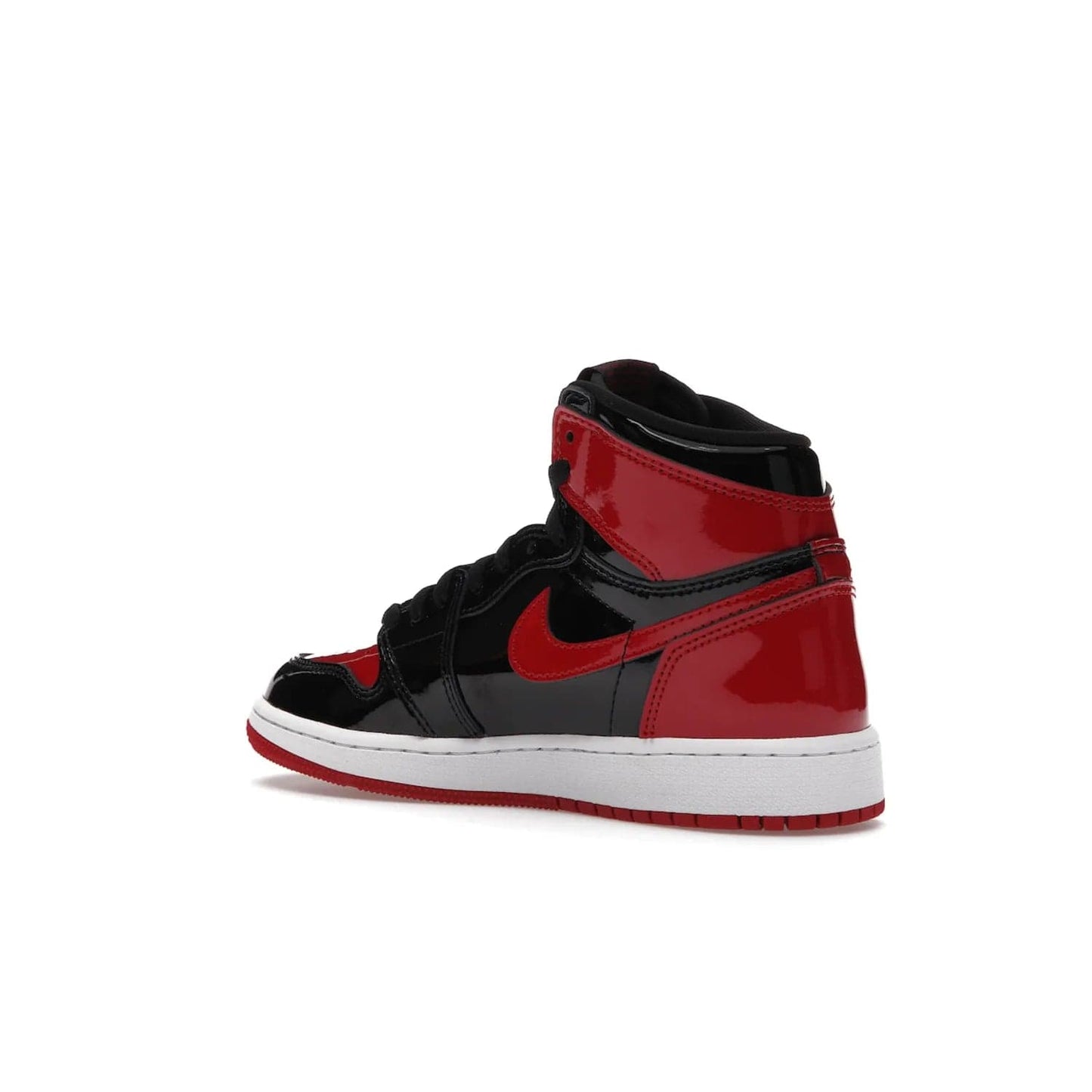 Jordan 1 Retro High OG Patent Bred (GS) - Image 23 - Only at www.BallersClubKickz.com - Upgrade your sneaker game with the iconic Air Jordan 1 Retro High OG Bred Patent GS. Crafted with premium patent leather and basketball-inspired details for a classic look, they also feature an encapsulated Air-sole cushioning and enhanced red rubber outsole. Don't miss this timeless sneaker with a striking black, white, and varsity red colorway, dropping December 2021.