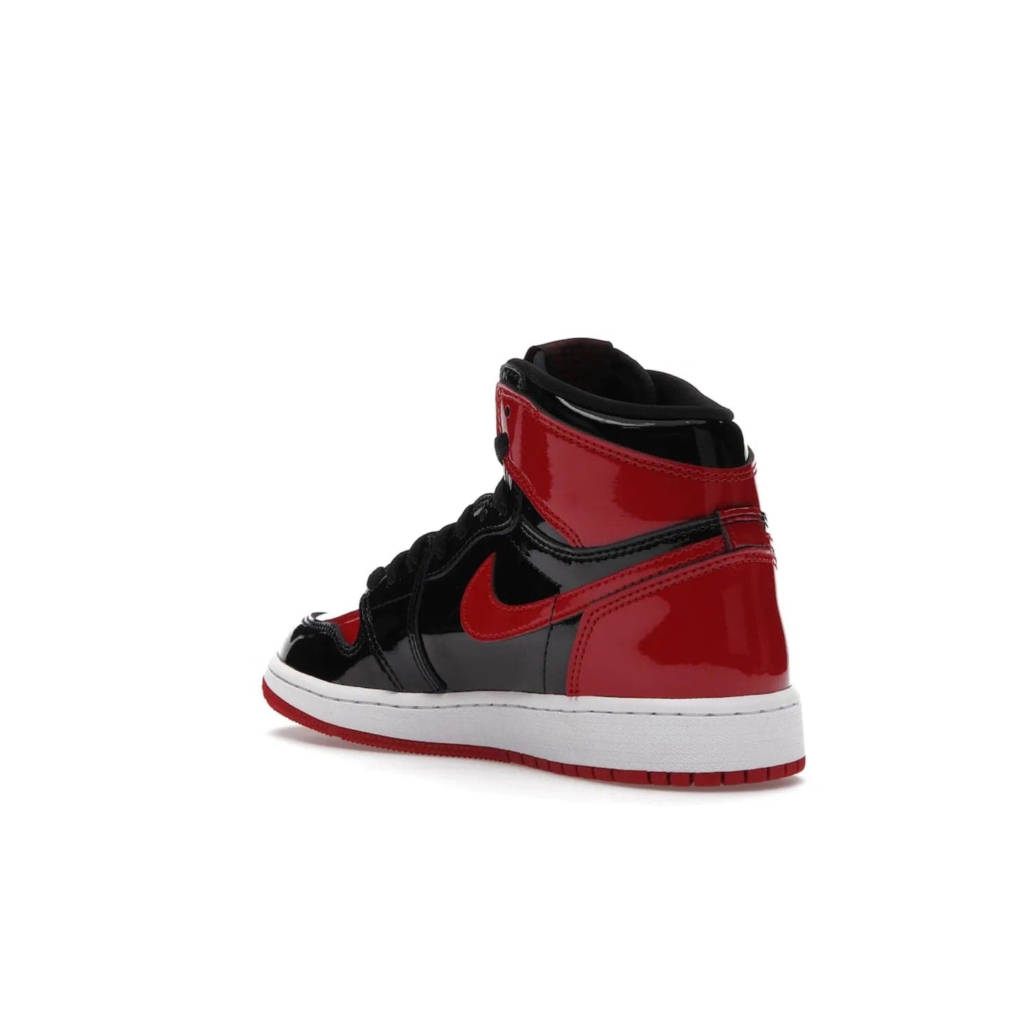 Jordan 1 Retro High OG Patent Bred (GS) - Image 24 - Only at www.BallersClubKickz.com - Upgrade your sneaker game with the iconic Air Jordan 1 Retro High OG Bred Patent GS. Crafted with premium patent leather and basketball-inspired details for a classic look, they also feature an encapsulated Air-sole cushioning and enhanced red rubber outsole. Don't miss this timeless sneaker with a striking black, white, and varsity red colorway, dropping December 2021.