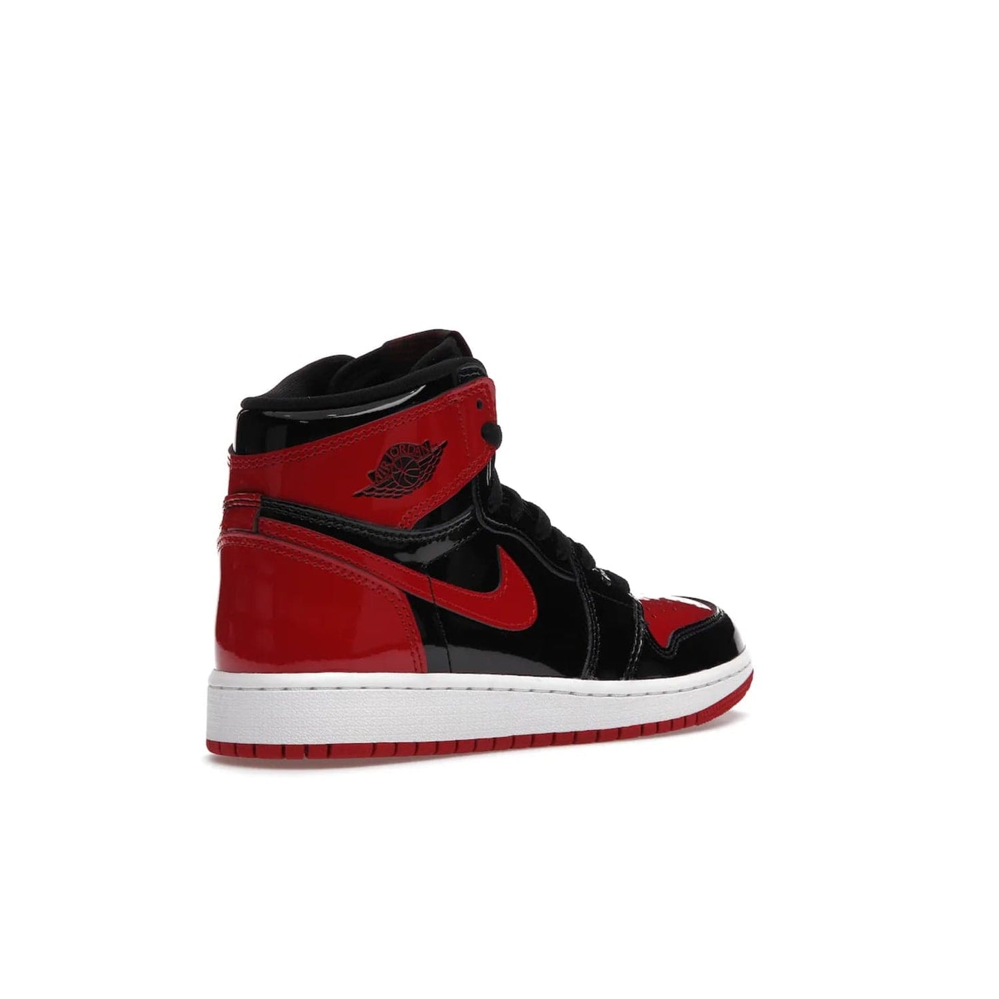 Jordan 1 Retro High OG Patent Bred (GS) - Image 33 - Only at www.BallersClubKickz.com - Upgrade your sneaker game with the iconic Air Jordan 1 Retro High OG Bred Patent GS. Crafted with premium patent leather and basketball-inspired details for a classic look, they also feature an encapsulated Air-sole cushioning and enhanced red rubber outsole. Don't miss this timeless sneaker with a striking black, white, and varsity red colorway, dropping December 2021.