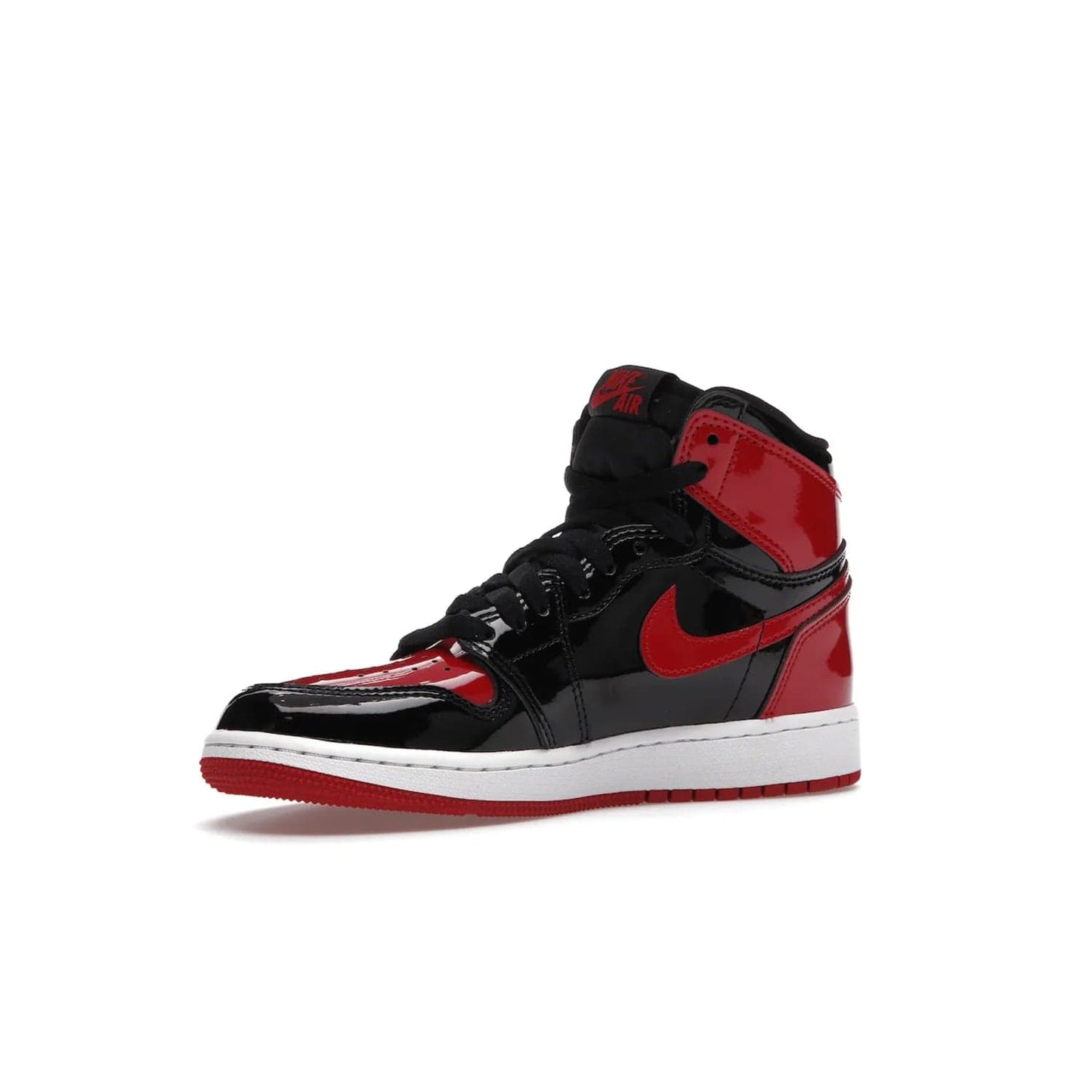 Jordan 1 Retro High OG Patent Bred (GS) - Image 16 - Only at www.BallersClubKickz.com - Upgrade your sneaker game with the iconic Air Jordan 1 Retro High OG Bred Patent GS. Crafted with premium patent leather and basketball-inspired details for a classic look, they also feature an encapsulated Air-sole cushioning and enhanced red rubber outsole. Don't miss this timeless sneaker with a striking black, white, and varsity red colorway, dropping December 2021.