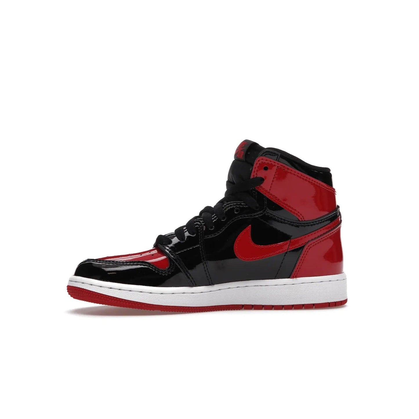 Jordan 1 Retro High OG Patent Bred (GS) - Image 18 - Only at www.BallersClubKickz.com - Upgrade your sneaker game with the iconic Air Jordan 1 Retro High OG Bred Patent GS. Crafted with premium patent leather and basketball-inspired details for a classic look, they also feature an encapsulated Air-sole cushioning and enhanced red rubber outsole. Don't miss this timeless sneaker with a striking black, white, and varsity red colorway, dropping December 2021.