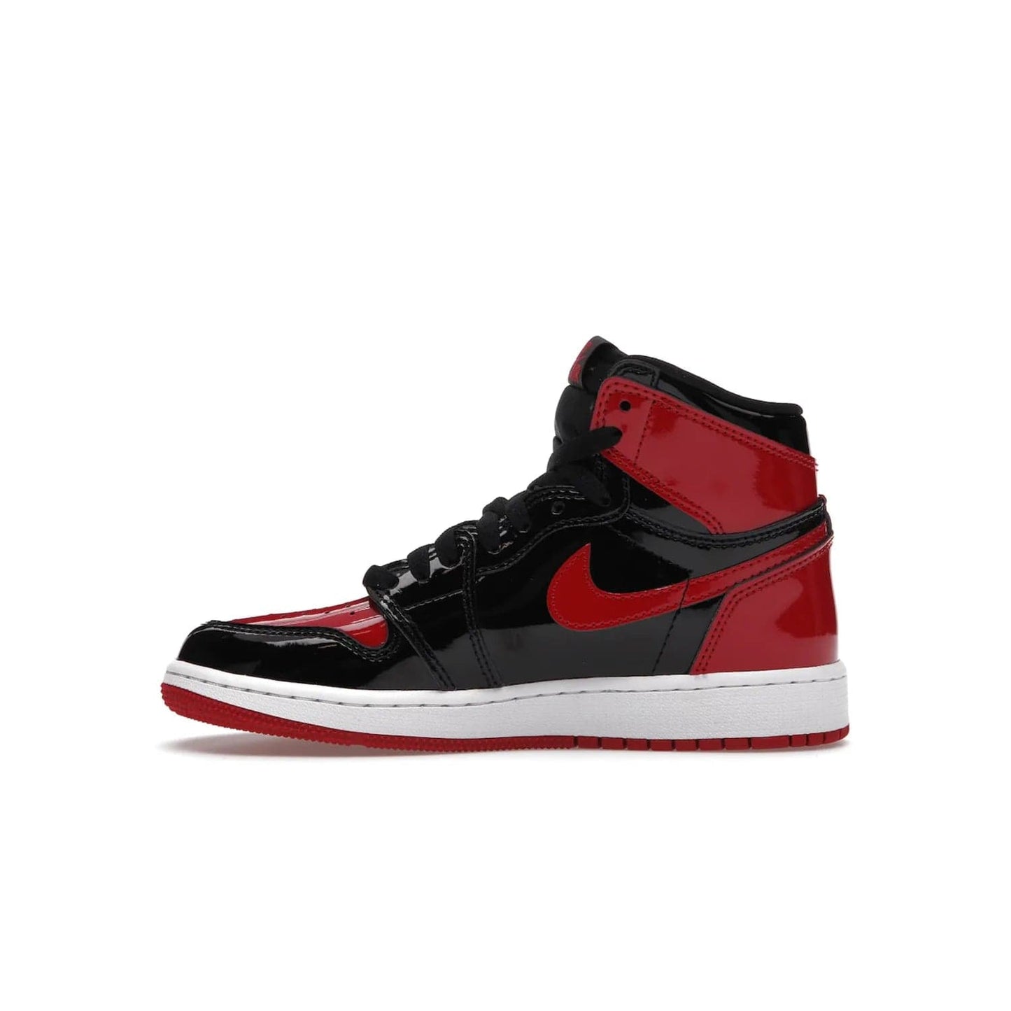 Jordan 1 Retro High OG Patent Bred (GS) - Image 19 - Only at www.BallersClubKickz.com - Upgrade your sneaker game with the iconic Air Jordan 1 Retro High OG Bred Patent GS. Crafted with premium patent leather and basketball-inspired details for a classic look, they also feature an encapsulated Air-sole cushioning and enhanced red rubber outsole. Don't miss this timeless sneaker with a striking black, white, and varsity red colorway, dropping December 2021.