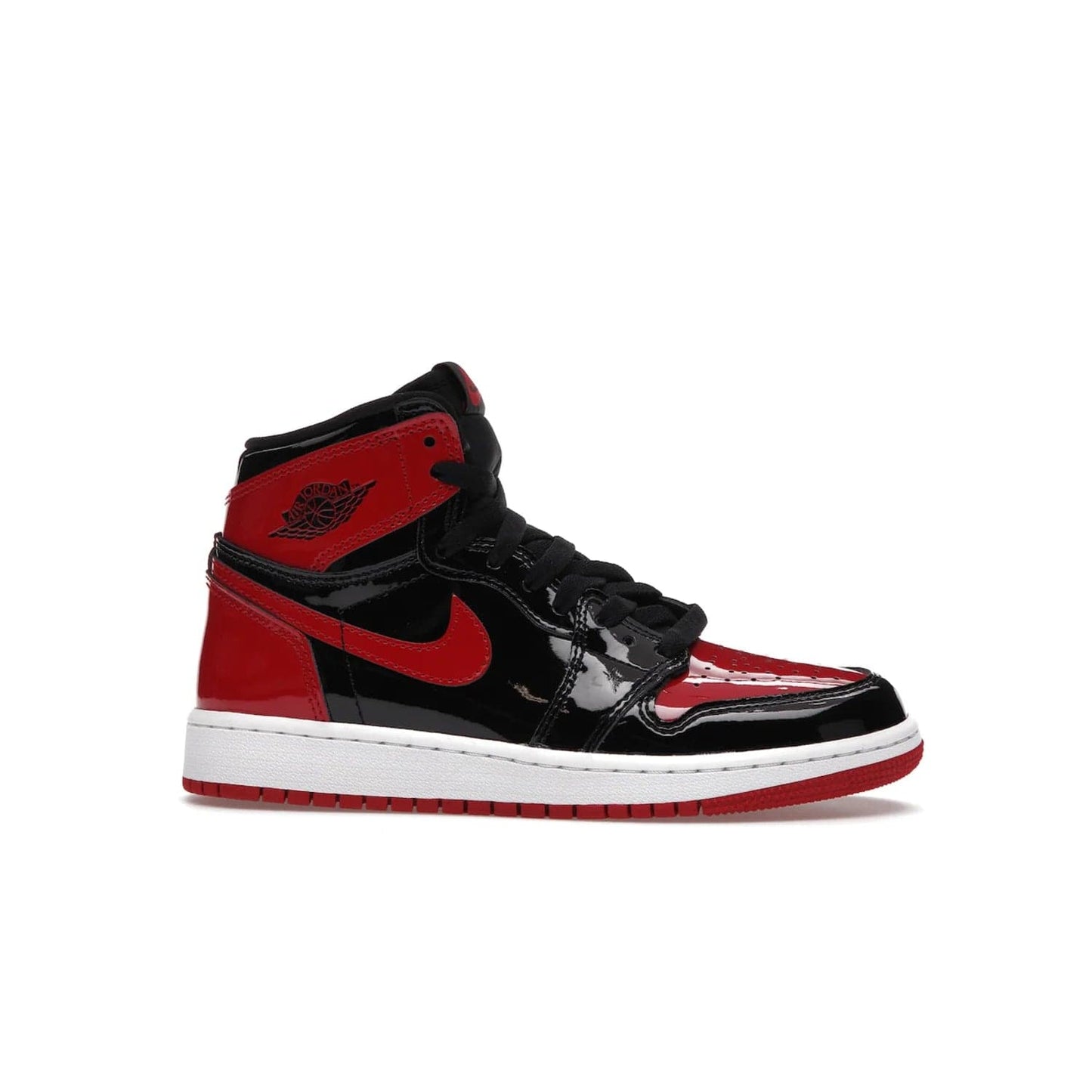 Jordan 1 Retro High OG Patent Bred (GS) - Image 2 - Only at www.BallersClubKickz.com - Upgrade your sneaker game with the iconic Air Jordan 1 Retro High OG Bred Patent GS. Crafted with premium patent leather and basketball-inspired details for a classic look, they also feature an encapsulated Air-sole cushioning and enhanced red rubber outsole. Don't miss this timeless sneaker with a striking black, white, and varsity red colorway, dropping December 2021.