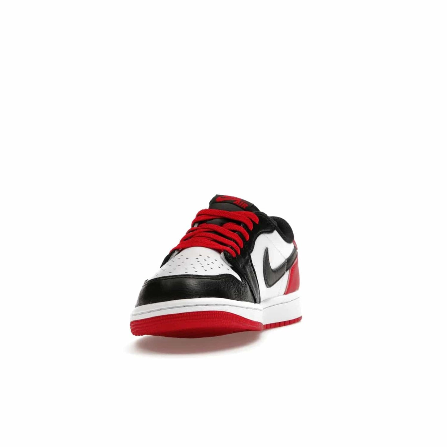 Jordan 1 Retro Low OG Black Toe (2023) - Image 12 - Only at www.BallersClubKickz.com - Upgrade your wardrobe with the Jordan 1 Retro Low OG Black Toe featuring a classic black and white upper and dynamic red heel counter. Eye-catching white midsole and iconic black Swoosh and Wings complete the timeless yet modern look. Shop now to own this iconic shoe!