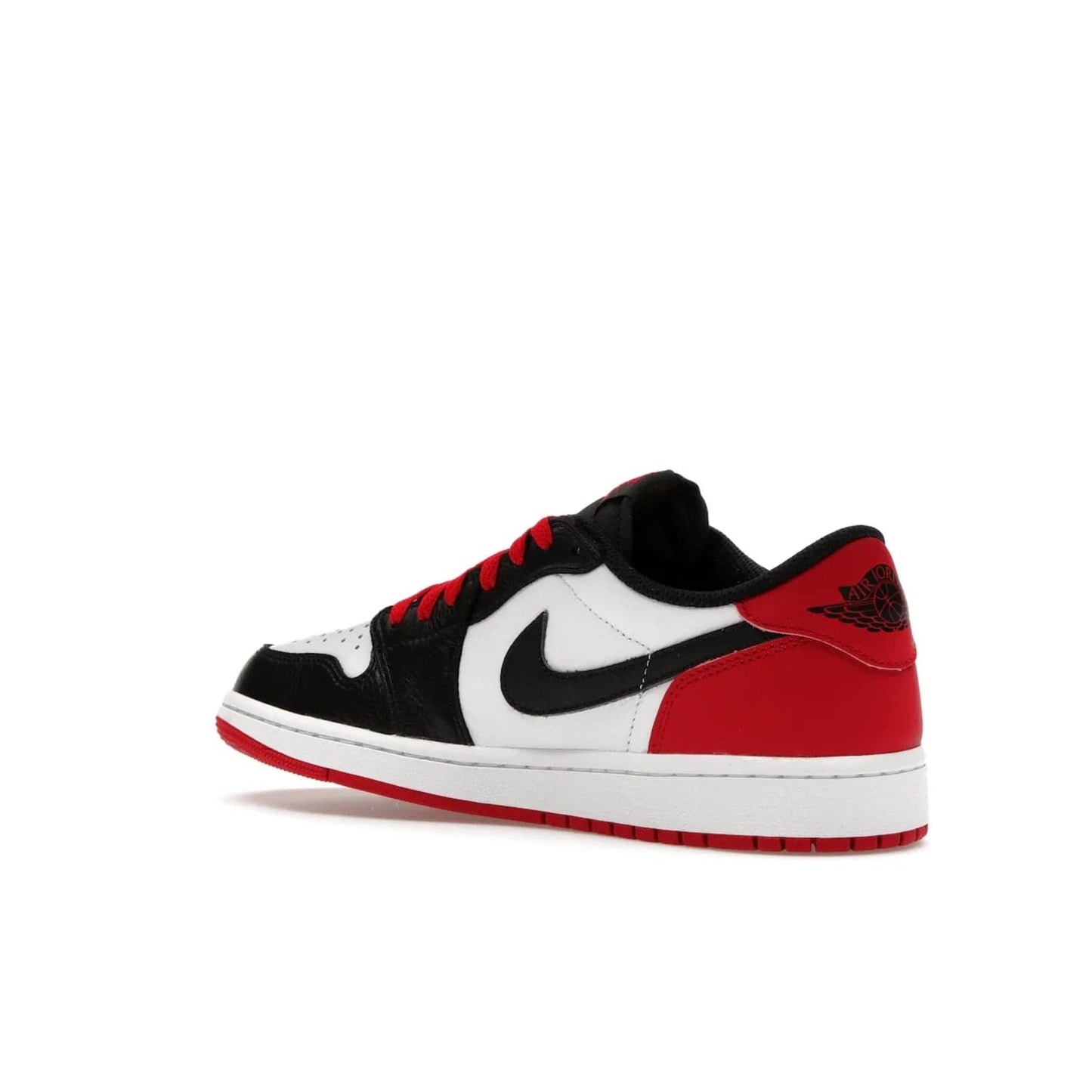 Jordan 1 Retro Low OG Black Toe (2023) - Image 23 - Only at www.BallersClubKickz.com - Upgrade your wardrobe with the Jordan 1 Retro Low OG Black Toe featuring a classic black and white upper and dynamic red heel counter. Eye-catching white midsole and iconic black Swoosh and Wings complete the timeless yet modern look. Shop now to own this iconic shoe!