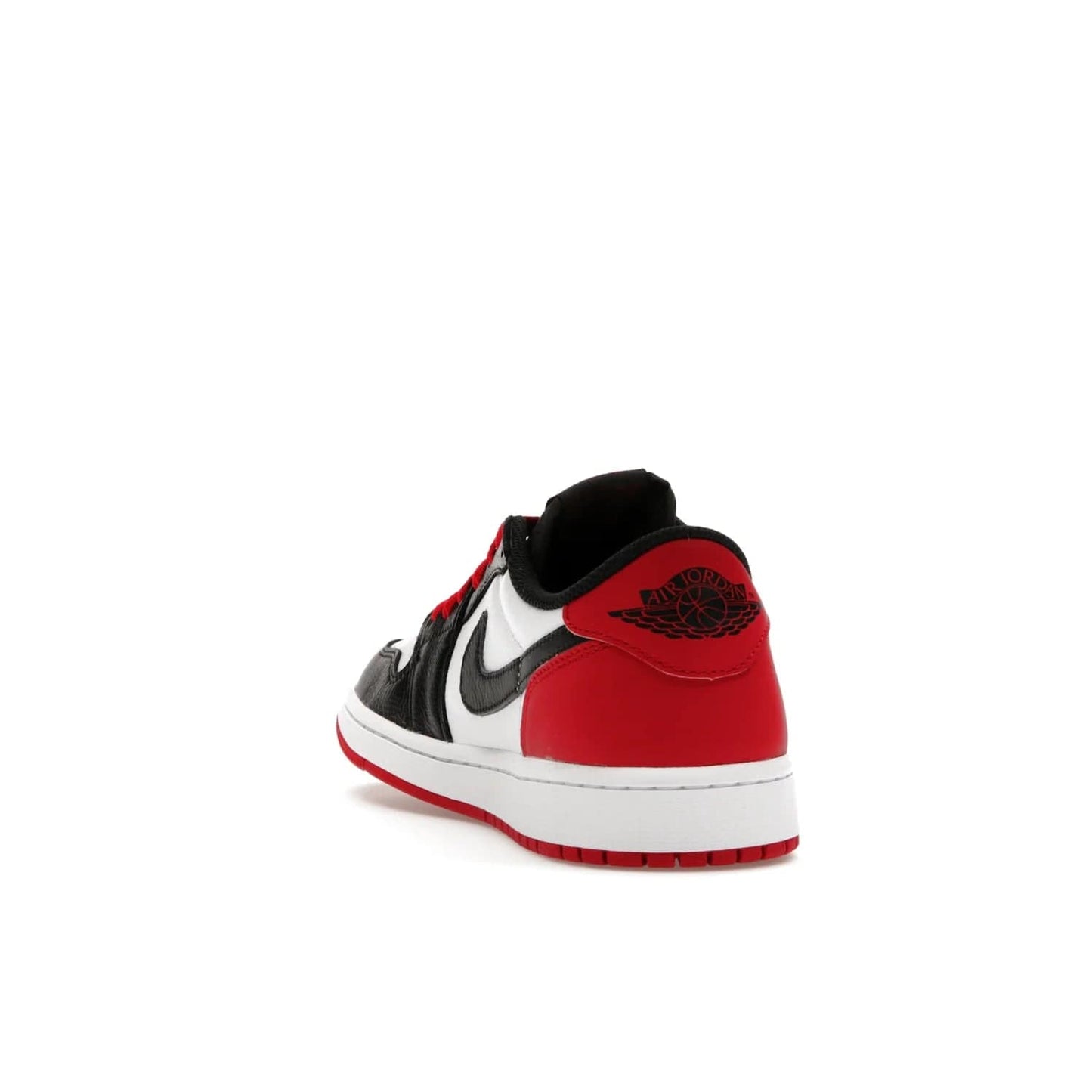 Jordan 1 Retro Low OG Black Toe (2023) - Image 26 - Only at www.BallersClubKickz.com - Upgrade your wardrobe with the Jordan 1 Retro Low OG Black Toe featuring a classic black and white upper and dynamic red heel counter. Eye-catching white midsole and iconic black Swoosh and Wings complete the timeless yet modern look. Shop now to own this iconic shoe!