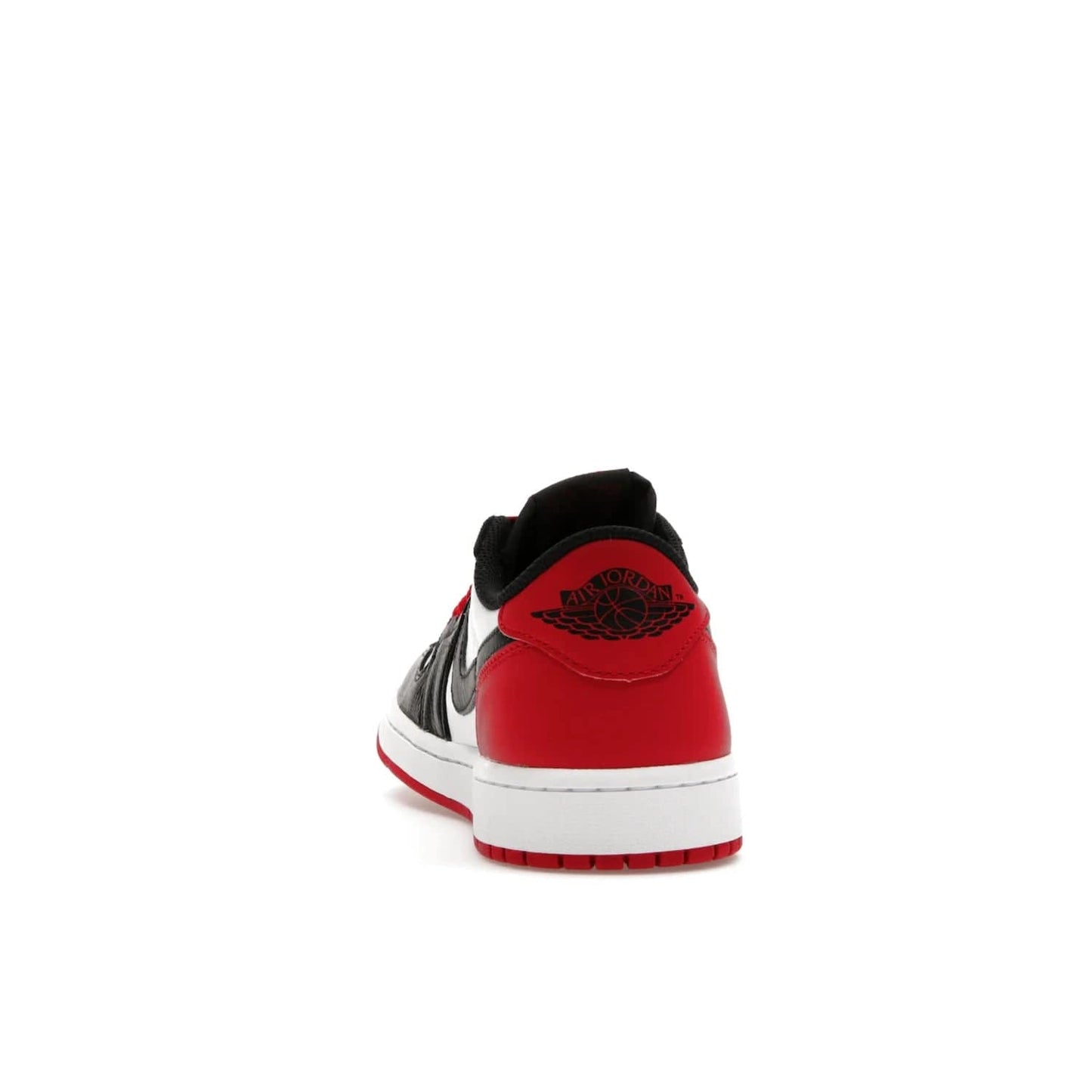 Jordan 1 Retro Low OG Black Toe (2023) - Image 27 - Only at www.BallersClubKickz.com - Upgrade your wardrobe with the Jordan 1 Retro Low OG Black Toe featuring a classic black and white upper and dynamic red heel counter. Eye-catching white midsole and iconic black Swoosh and Wings complete the timeless yet modern look. Shop now to own this iconic shoe!