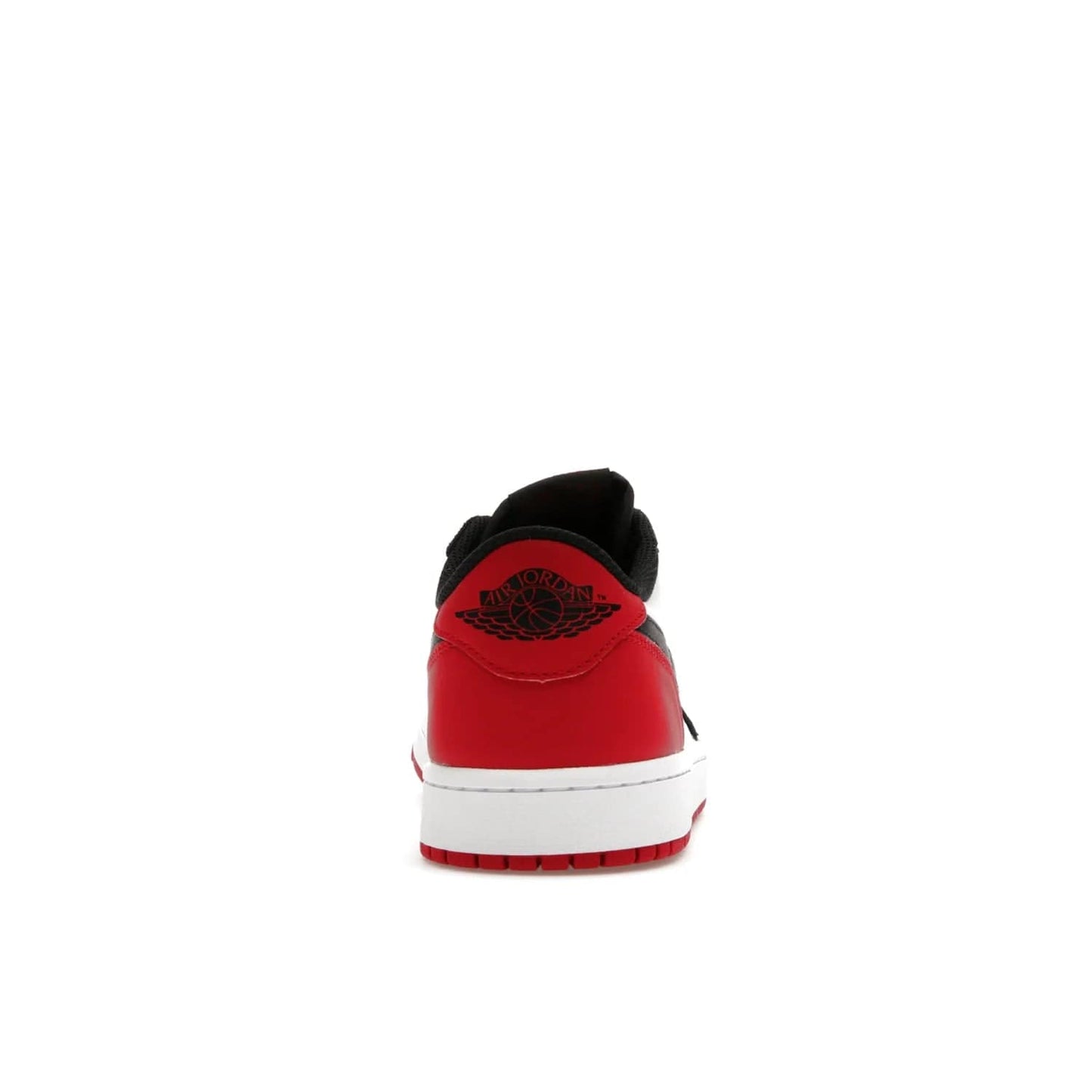 Jordan 1 Retro Low OG Black Toe (2023) - Image 28 - Only at www.BallersClubKickz.com - Upgrade your wardrobe with the Jordan 1 Retro Low OG Black Toe featuring a classic black and white upper and dynamic red heel counter. Eye-catching white midsole and iconic black Swoosh and Wings complete the timeless yet modern look. Shop now to own this iconic shoe!