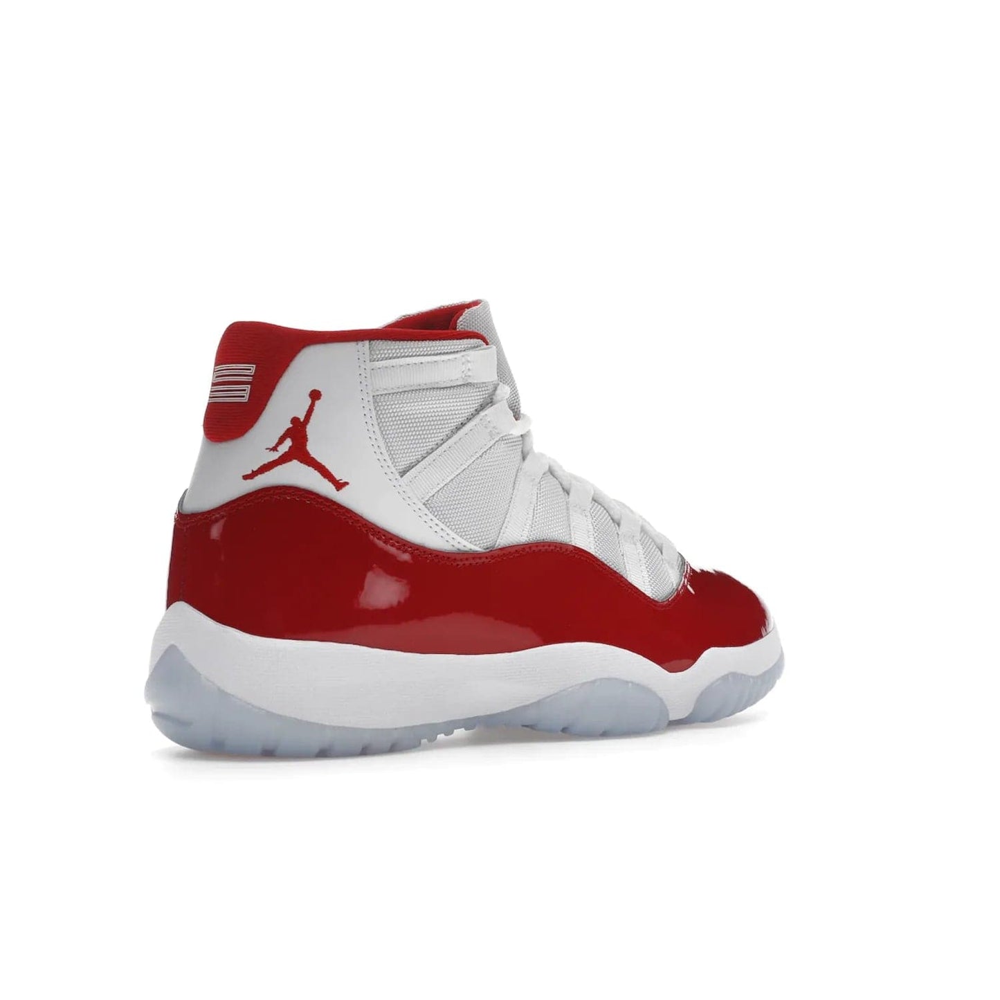 Jordan 11 Retro Cherry (2022) - Image 33 - Only at www.BallersClubKickz.com - The Air Jordan 11 Cherry features classic patent leather with Cherry red accents, icy blue outsole, and debossed 23 on the heel tab. Refresh your sneaker game with this iconic update, available December 10, 2022.