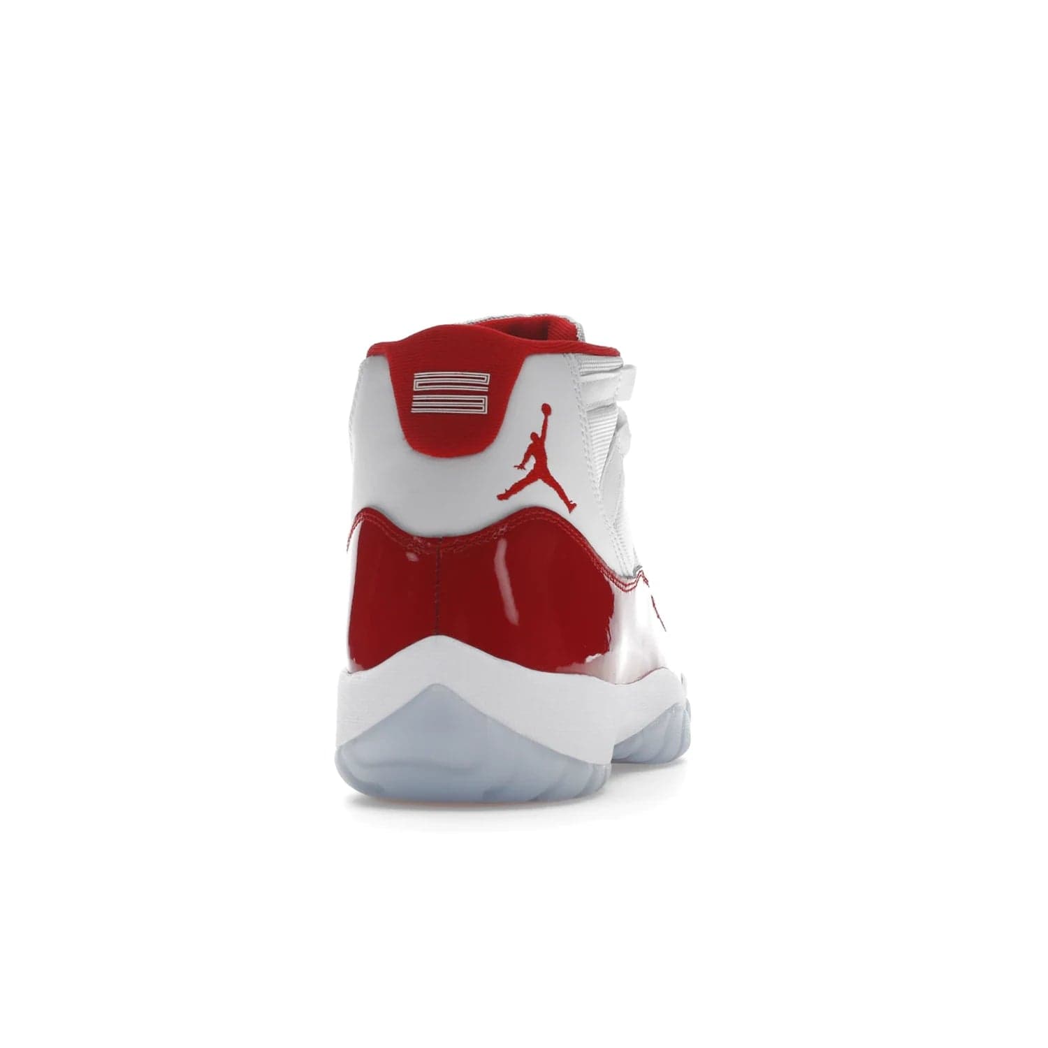 Jordan 11 Retro Cherry (2022) - Image 29 - Only at www.BallersClubKickz.com - The Air Jordan 11 Cherry features classic patent leather with Cherry red accents, icy blue outsole, and debossed 23 on the heel tab. Refresh your sneaker game with this iconic update, available December 10, 2022.
