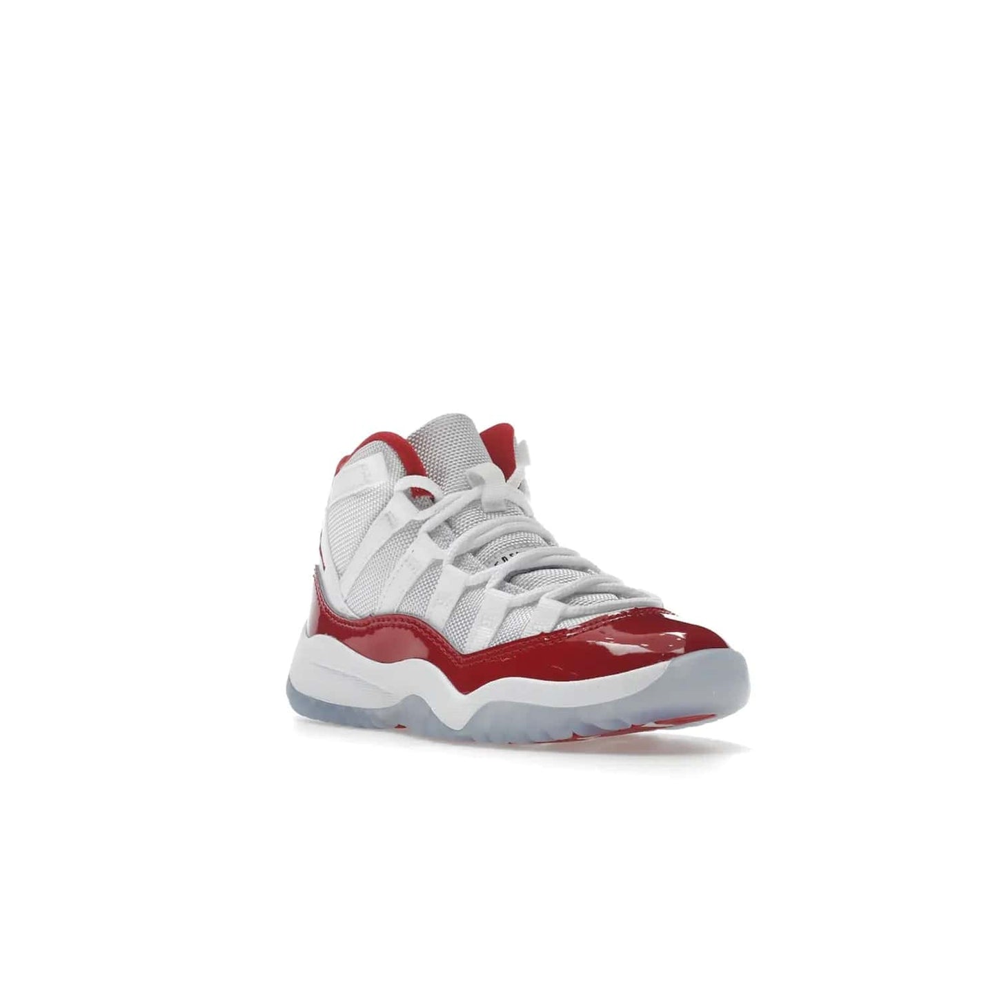 Jordan 11 Retro Cherry (2022) (PS) - Image 6 - Only at www.BallersClubKickz.com - An iconic silhouette with a timeless look, the Air Jordan 11 Retro Cherry 2022 PS features a crisp White, Varsity Red and Black colorway. The upper is made of ballistic mesh, a red patent leather mudguard, '23' branding and white Phylon midsole. Get optimal cushioning and comfort on December 10th, 2022. Don't miss out.