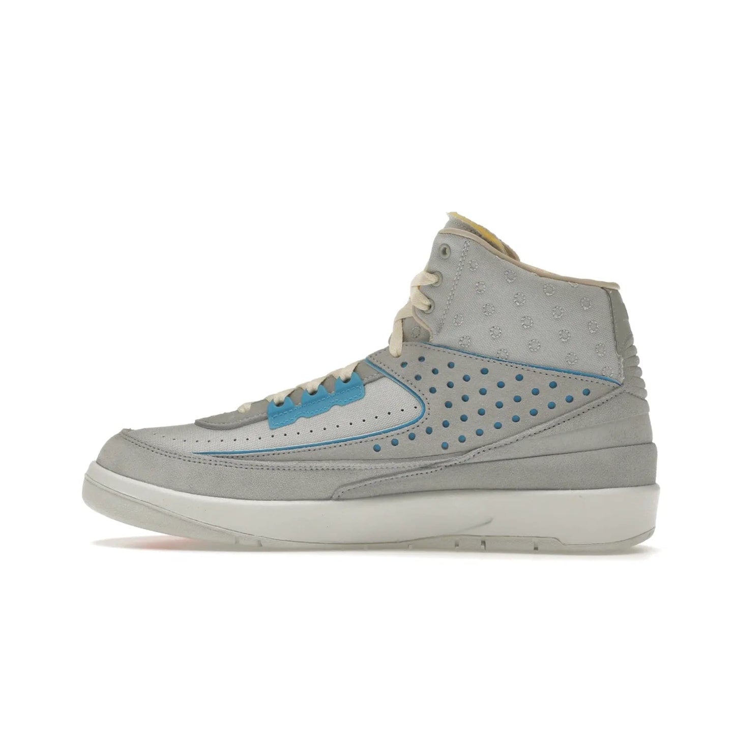 Jordan 2 Retro SP Union Grey Fog - Image 20 - Only at www.BallersClubKickz.com - Introducing the Air Jordan 2 Retro SP Union Grey Fog. This intricate sneaker design features a grey canvas upper with light blue eyelets, eyestay patches, and piping, plus custom external tags. Dropping in April 2022, this exclusive release offers a worn-in look and feel.