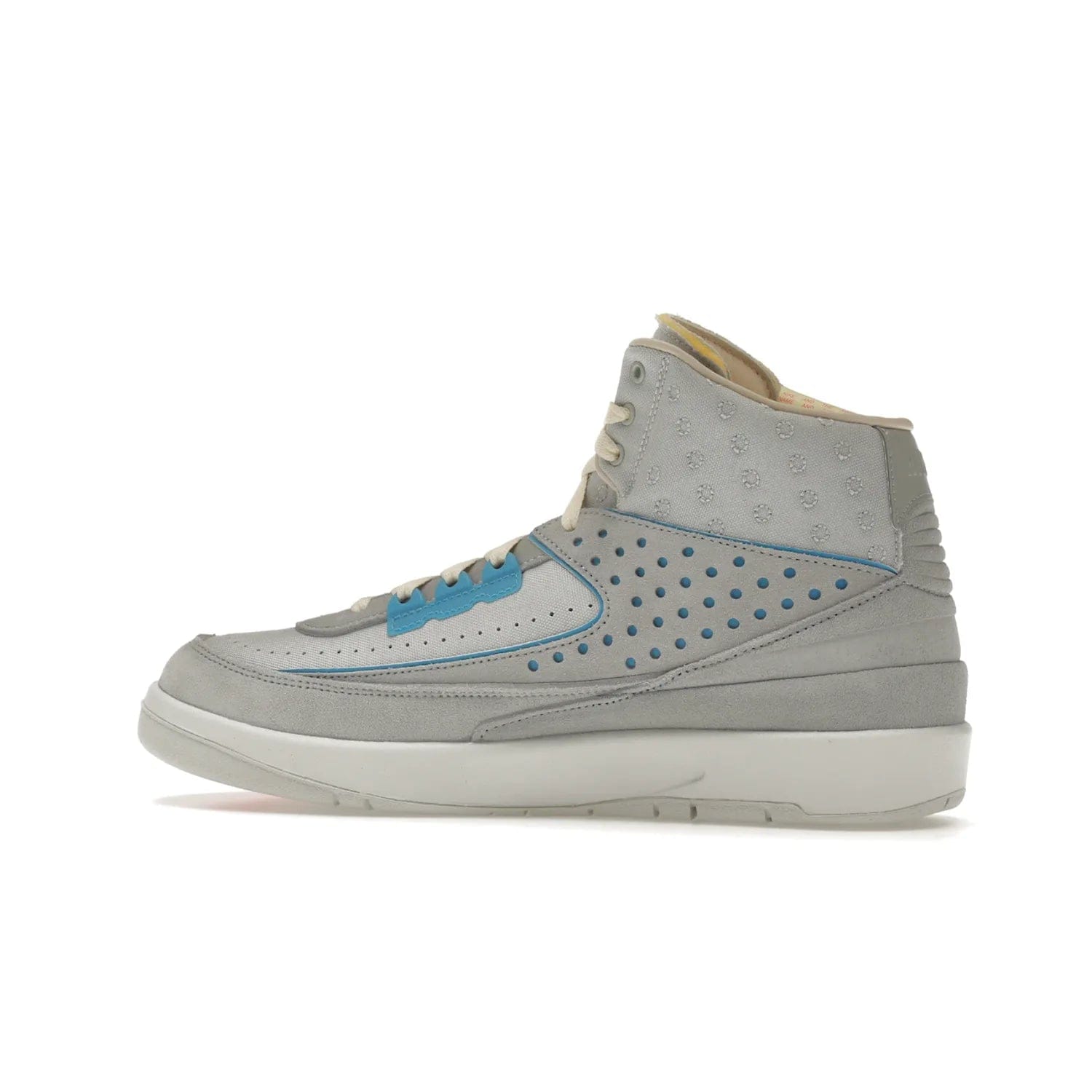 Jordan 2 Retro SP Union Grey Fog - Image 21 - Only at www.BallersClubKickz.com - Introducing the Air Jordan 2 Retro SP Union Grey Fog. This intricate sneaker design features a grey canvas upper with light blue eyelets, eyestay patches, and piping, plus custom external tags. Dropping in April 2022, this exclusive release offers a worn-in look and feel.