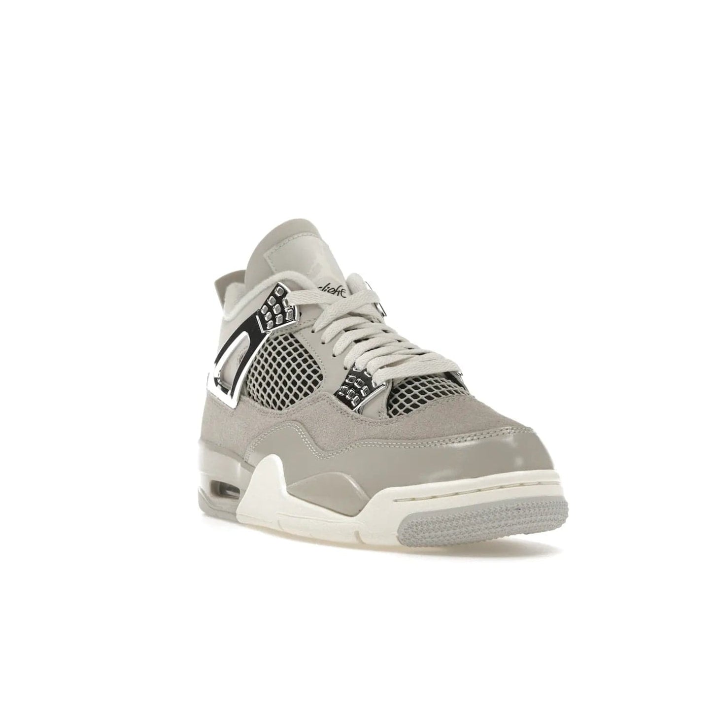 Jordan 4 Retro Frozen Moments (Women's) - Image 7 - Only at www.BallersClubKickz.com - The Jordan 4 Retro Frozen Moments is a stylish blend of classic design elements and modern tones. Featuring suede and leather overlays in a light iron-ore, sail, neutral grey, black, and metallic silver colorway. Get this iconic high-performance sneaker for $210.