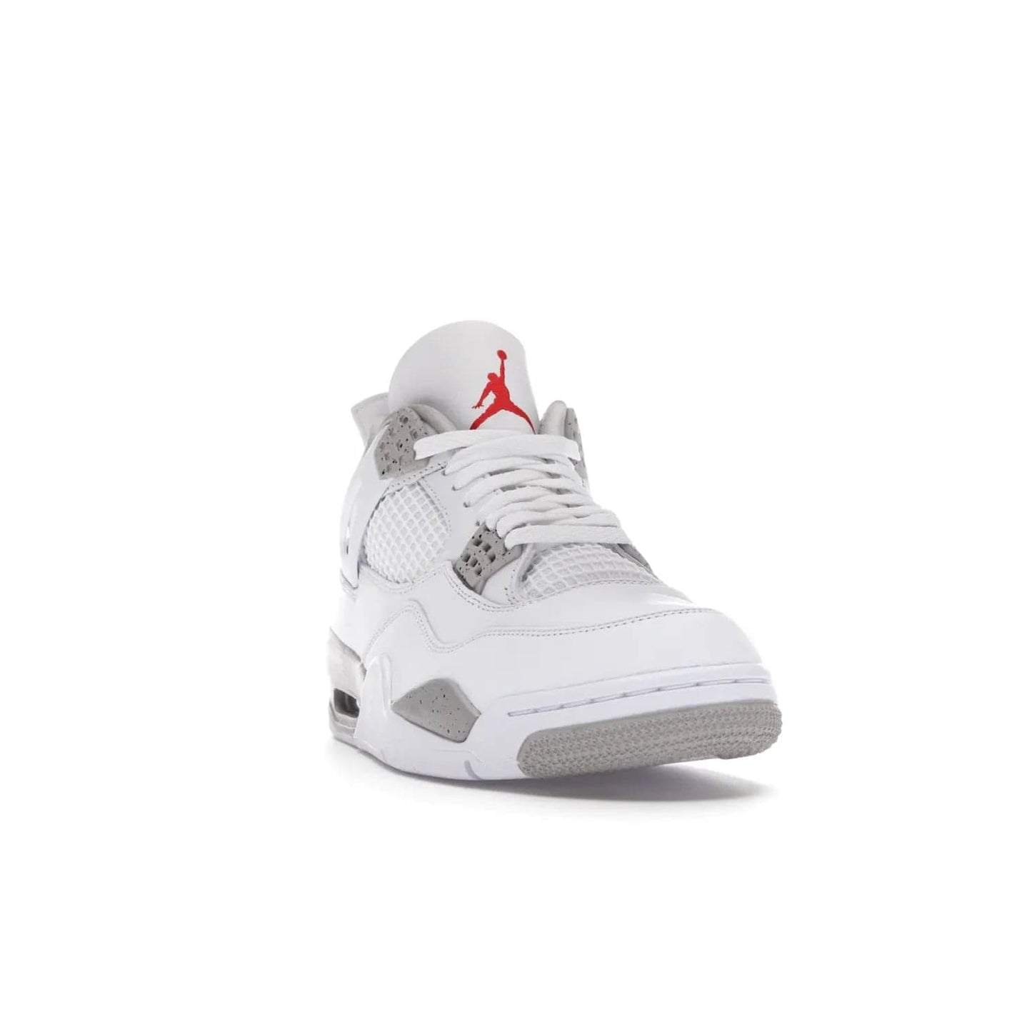 Jordan 4 Retro White Oreo (2021) - Image 8 - Only at www.BallersClubKickz.com - Update your sneaker style with the Air Jordan 4 Retro White Oreo. Limited-edition sneaker features white leather and mesh upper, Tech Grey eyelets and midsole, Jumpman logo embroidered on the tongue, and more. Released exclusively on Saturday, July 3rd.