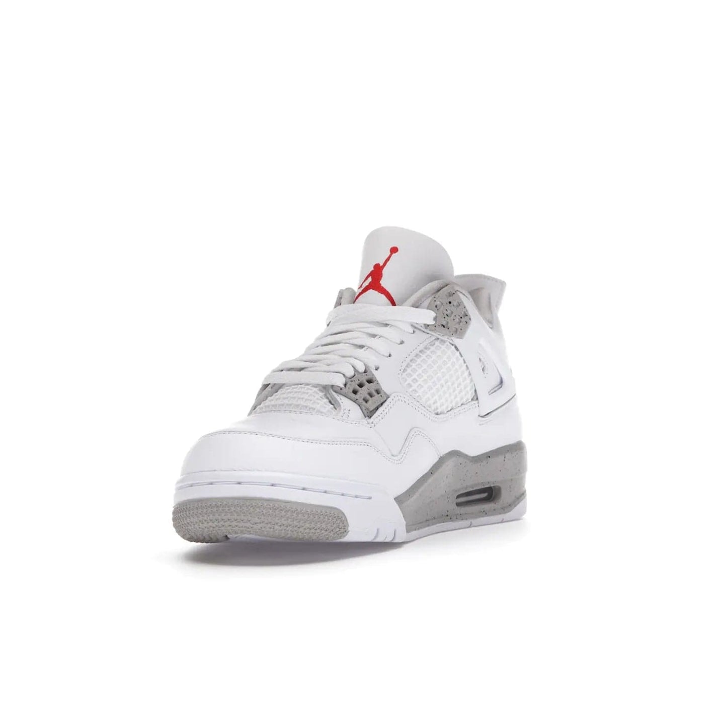 Jordan 4 Retro White Oreo (2021) - Image 13 - Only at www.BallersClubKickz.com - Update your sneaker style with the Air Jordan 4 Retro White Oreo. Limited-edition sneaker features white leather and mesh upper, Tech Grey eyelets and midsole, Jumpman logo embroidered on the tongue, and more. Released exclusively on Saturday, July 3rd.