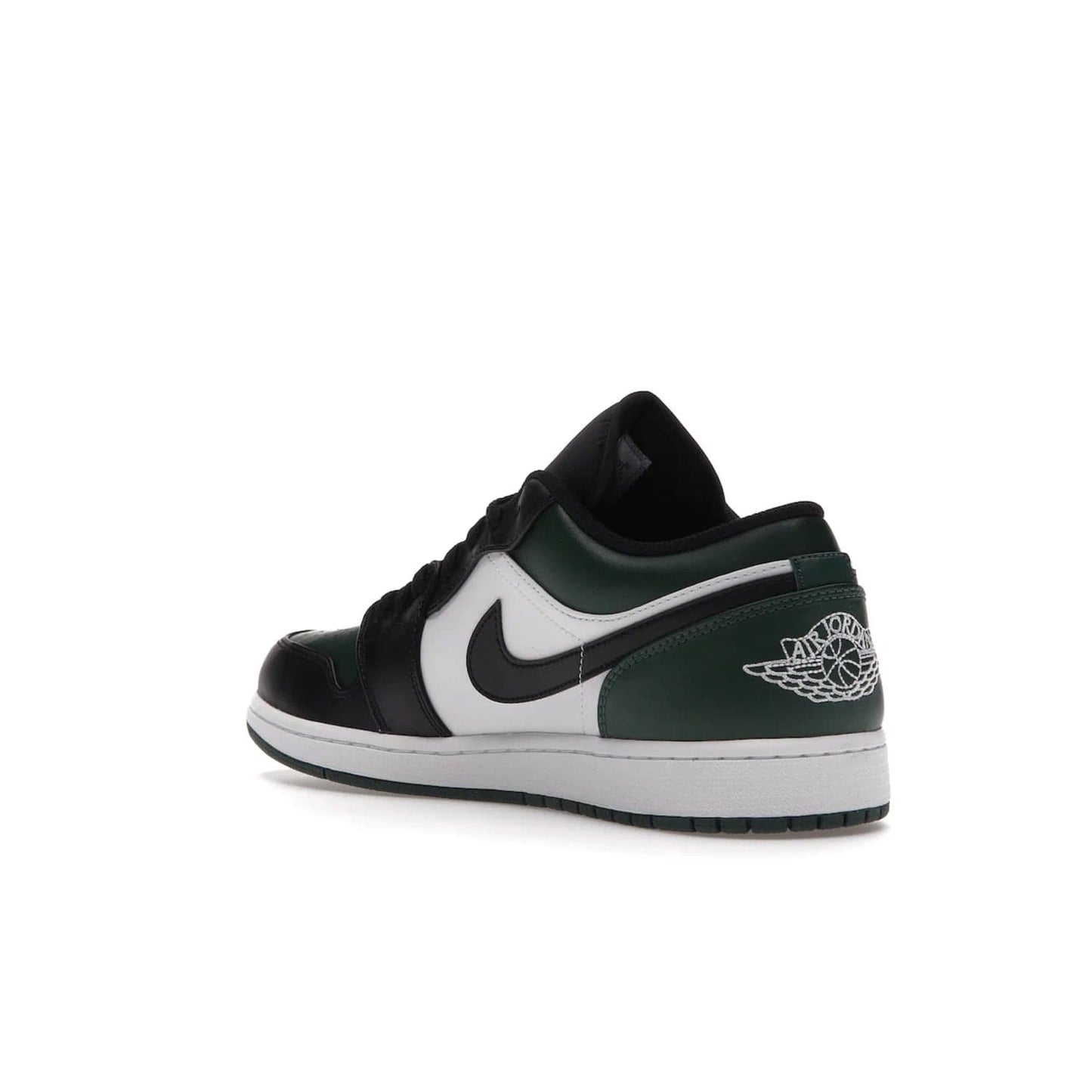 Jordan 1 Low Green Toe - Image 24 - Only at www.BallersClubKickz.com - The Jordan 1 Low Green Toe features white, black and Noble Green leather with black Swoosh. Get the classic Bred Toe-inspired color blocking with green perforated toe box. White and green Air sole completes the design. Released in October 2021 at only $100. Grab your pair now!