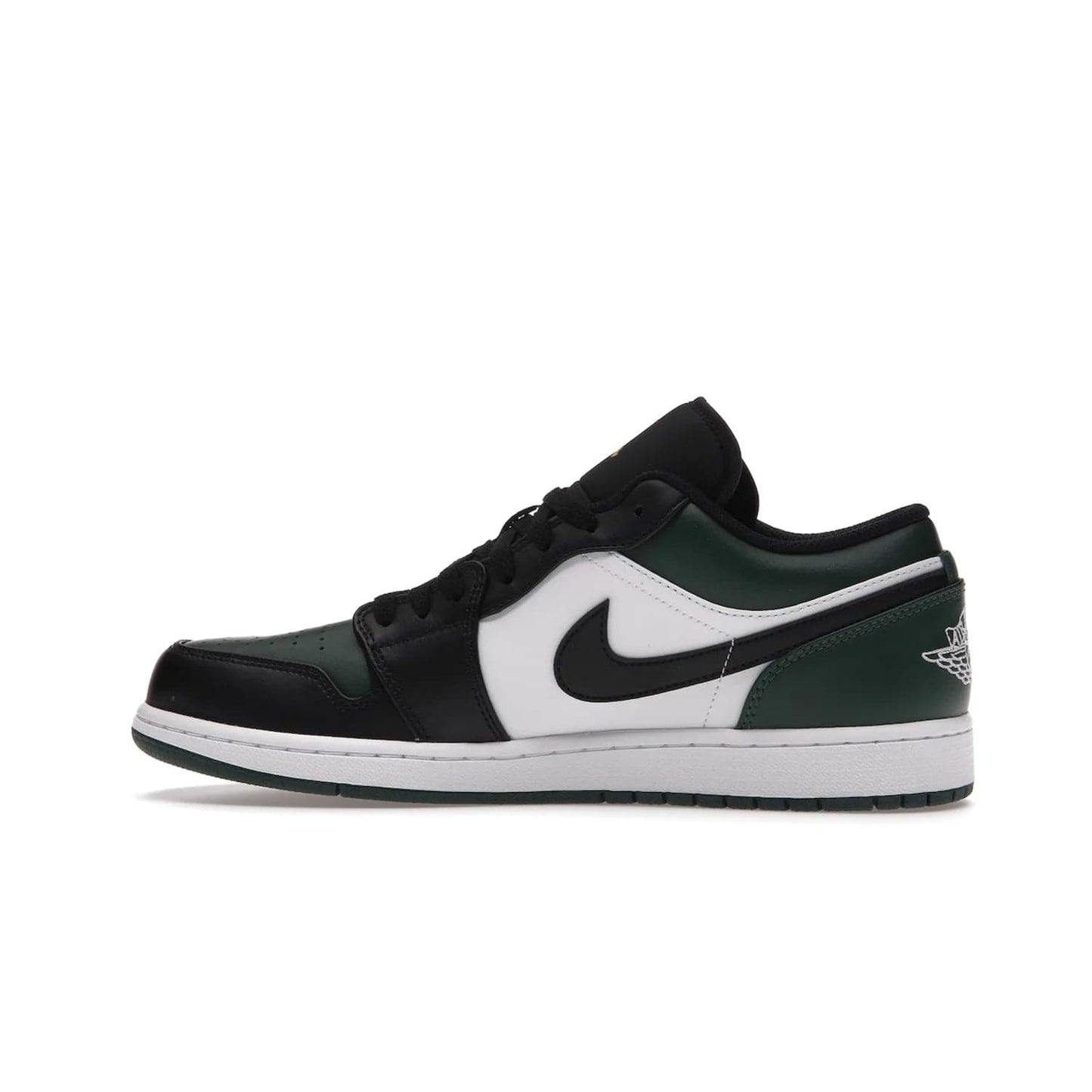 Jordan 1 Low Green Toe - Image 20 - Only at www.BallersClubKickz.com - The Jordan 1 Low Green Toe features white, black and Noble Green leather with black Swoosh. Get the classic Bred Toe-inspired color blocking with green perforated toe box. White and green Air sole completes the design. Released in October 2021 at only $100. Grab your pair now!