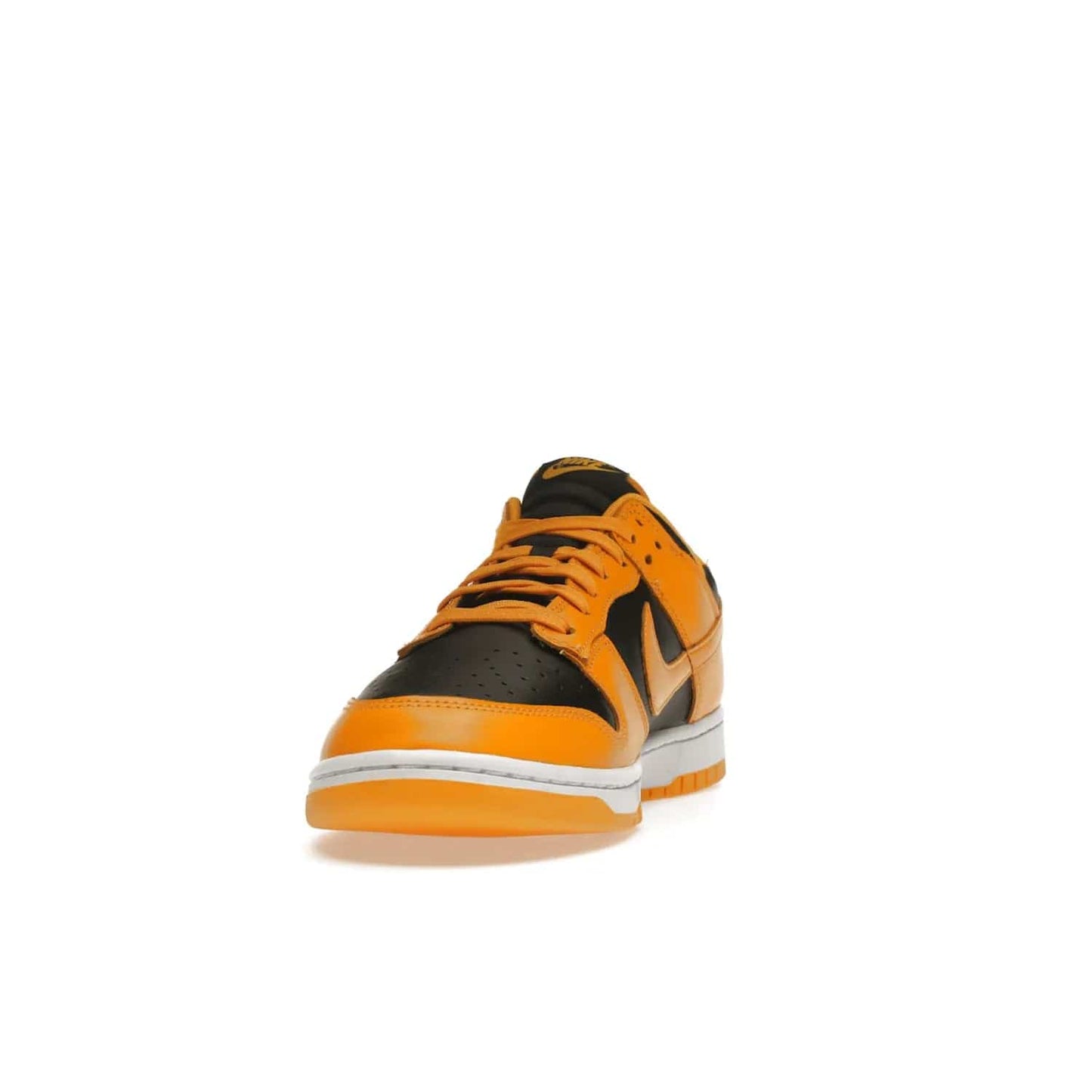 Nike Dunk Low Championship Goldenrod (2021) - Image 12 - Only at www.BallersClubKickz.com - Iconic silhouette Nike Dunk Low is back with a luxe look. Featuring a black upper, goldenrod overlays, and white and yellow Nike Air sole, this retro inspired design is perfect for the sneaker culture enthusiast. Releasing in December 2021 at $100.