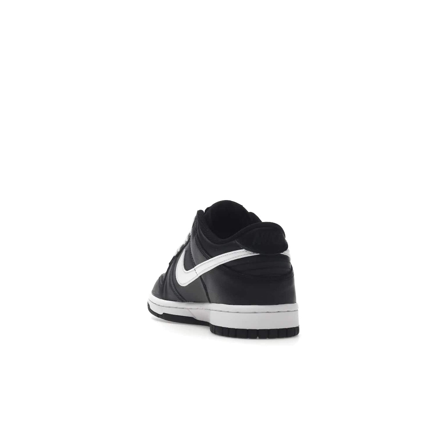 Nike Dunk Low Black White (2022) (GS) - Image 26 - Only at www.BallersClubKickz.com - A classic two-tone upper of black & off white, low profile midsole, and patterned rubber outsole make the Nike Dunk Low Black White 2022 GS perfect for any style. Get the complete look and release date on July 12, 2022.