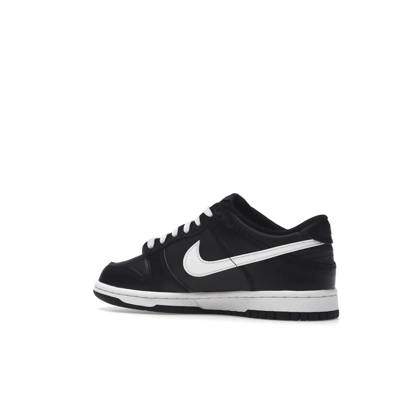 Nike Dunk Low Black White (2022) (GS) - Image 22 - Only at www.BallersClubKickz.com - A classic two-tone upper of black & off white, low profile midsole, and patterned rubber outsole make the Nike Dunk Low Black White 2022 GS perfect for any style. Get the complete look and release date on July 12, 2022.