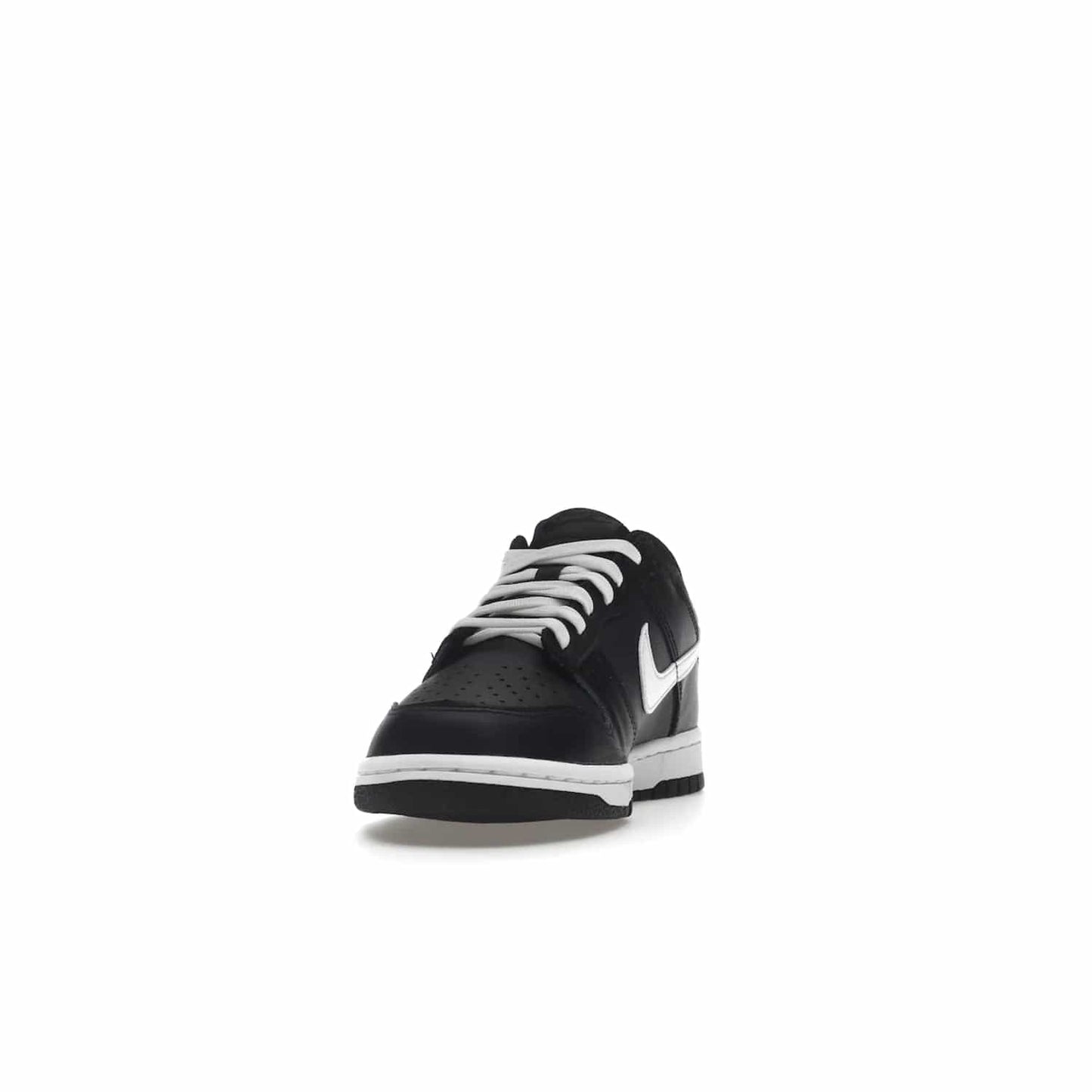 Nike Dunk Low Black White (2022) (GS) - Image 12 - Only at www.BallersClubKickz.com - A classic two-tone upper of black & off white, low profile midsole, and patterned rubber outsole make the Nike Dunk Low Black White 2022 GS perfect for any style. Get the complete look and release date on July 12, 2022.