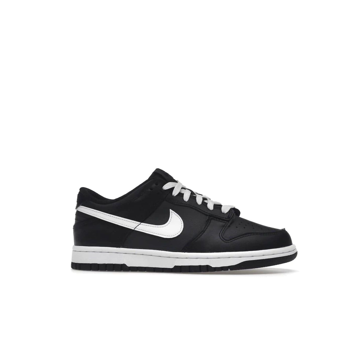 Nike Dunk Low Black White (2022) (GS) - Image 2 - Only at www.BallersClubKickz.com - A classic two-tone upper of black & off white, low profile midsole, and patterned rubber outsole make the Nike Dunk Low Black White 2022 GS perfect for any style. Get the complete look and release date on July 12, 2022.