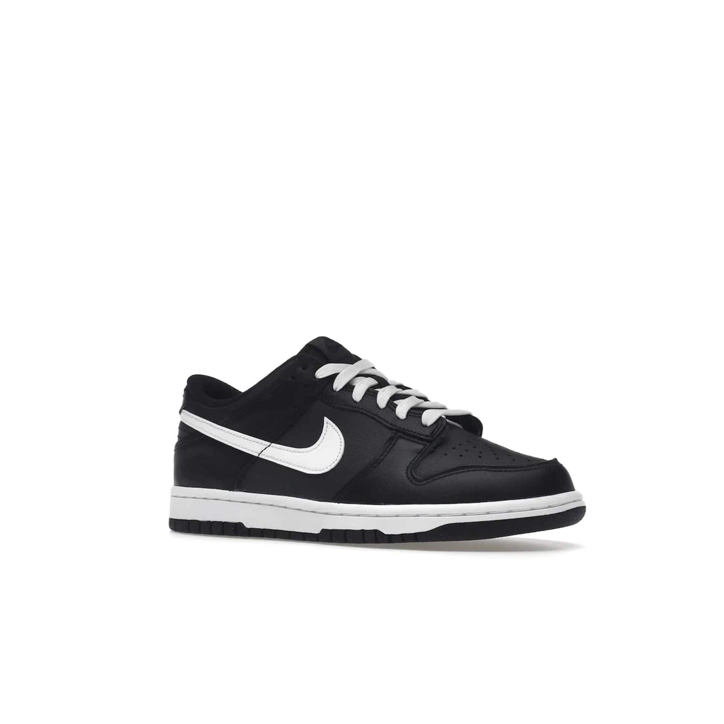 Nike Dunk Low Black White (2022) (GS) - Image 4 - Only at www.BallersClubKickz.com - A classic two-tone upper of black & off white, low profile midsole, and patterned rubber outsole make the Nike Dunk Low Black White 2022 GS perfect for any style. Get the complete look and release date on July 12, 2022.