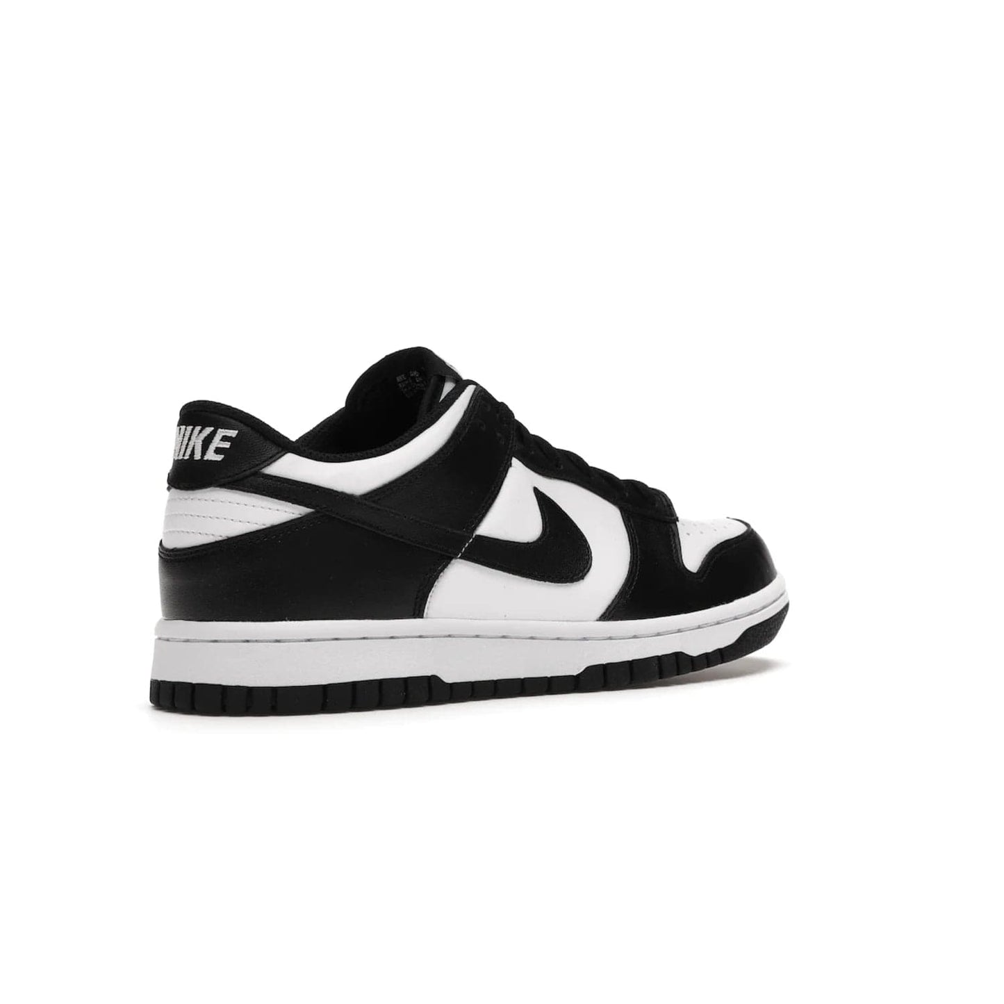 Nike Dunk Low Retro White Black Panda (2021) (GS) - Image 33 - Only at www.BallersClubKickz.com - Upgrade your style with the Nike Dunk Low Retro White Black (GS). Featuring premium leather, iconic Nike text, signature Swoosh logo and striking black/white colorway, this striking silhouette is the perfect mix of style and comfort. Colorway released in March 2021.