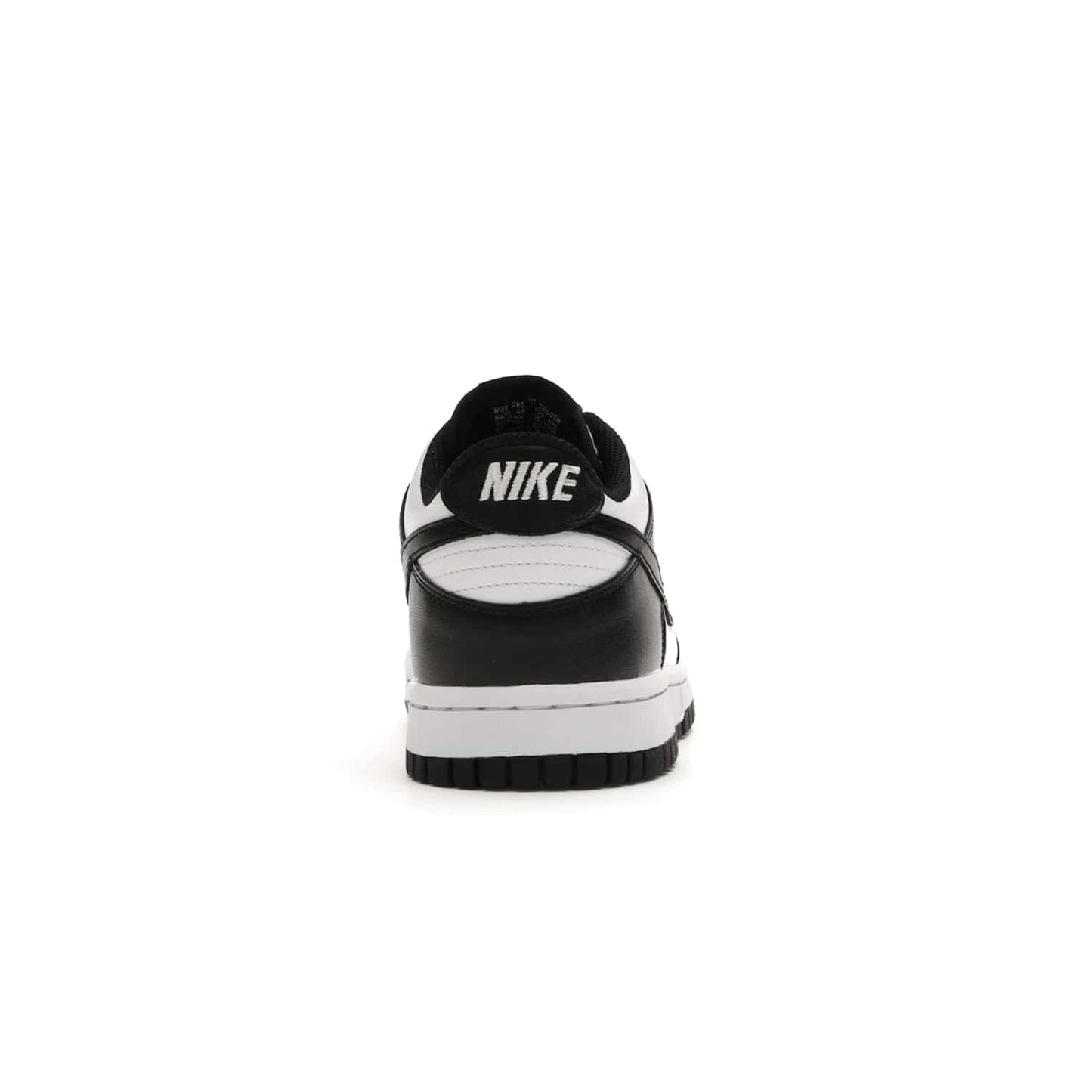 Nike Dunk Low Retro White Black Panda (2021) (GS) - Image 28 - Only at www.BallersClubKickz.com - Upgrade your style with the Nike Dunk Low Retro White Black (GS). Featuring premium leather, iconic Nike text, signature Swoosh logo and striking black/white colorway, this striking silhouette is the perfect mix of style and comfort. Colorway released in March 2021.