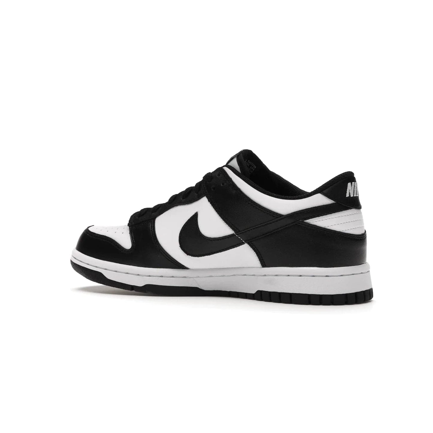 Nike Dunk Low Retro White Black Panda (2021) (GS) - Image 22 - Only at www.BallersClubKickz.com - Upgrade your style with the Nike Dunk Low Retro White Black (GS). Featuring premium leather, iconic Nike text, signature Swoosh logo and striking black/white colorway, this striking silhouette is the perfect mix of style and comfort. Colorway released in March 2021.