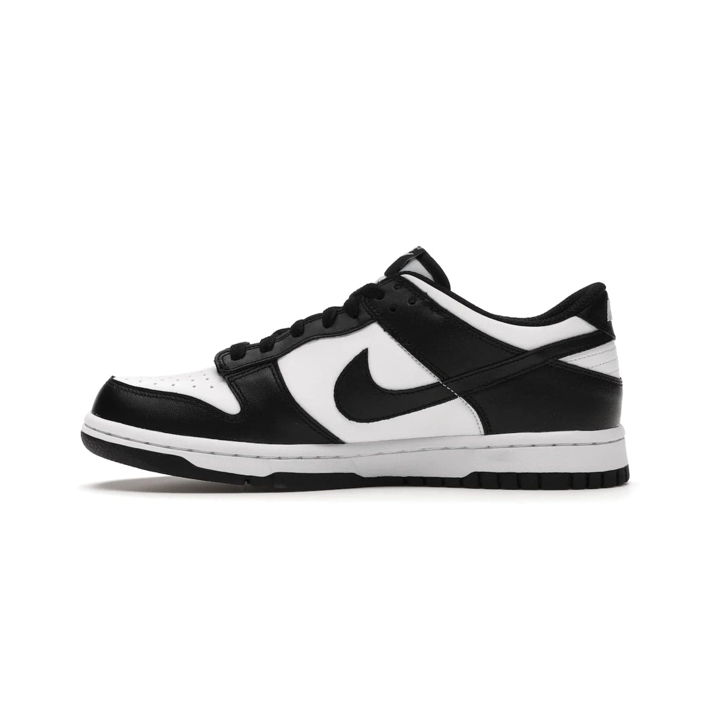 Nike Dunk Low Retro White Black Panda (2021) (GS) - Image 19 - Only at www.BallersClubKickz.com - Upgrade your style with the Nike Dunk Low Retro White Black (GS). Featuring premium leather, iconic Nike text, signature Swoosh logo and striking black/white colorway, this striking silhouette is the perfect mix of style and comfort. Colorway released in March 2021.
