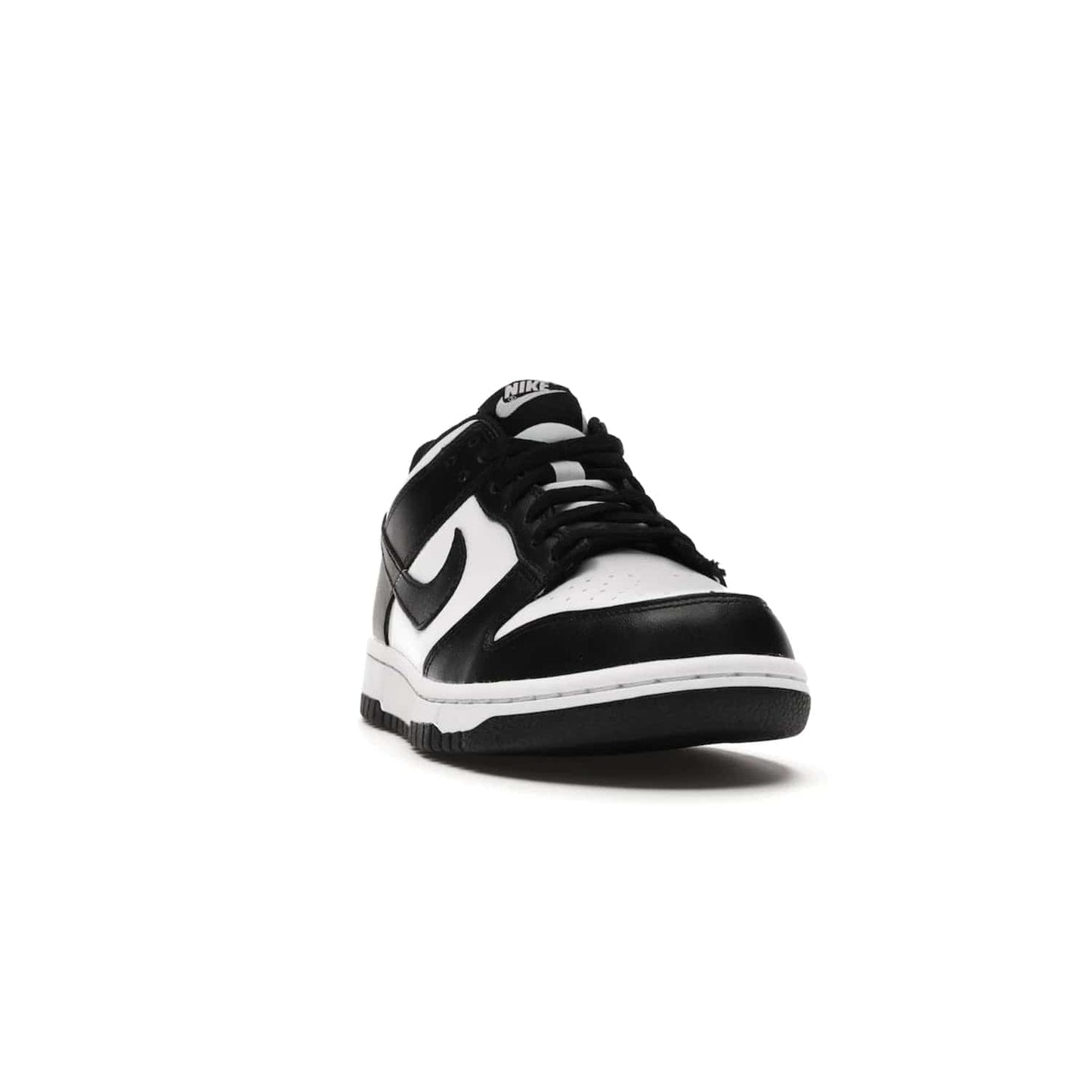 Nike Dunk Low Retro White Black Panda (2021) (GS) - Image 8 - Only at www.BallersClubKickz.com - Upgrade your style with the Nike Dunk Low Retro White Black (GS). Featuring premium leather, iconic Nike text, signature Swoosh logo and striking black/white colorway, this striking silhouette is the perfect mix of style and comfort. Colorway released in March 2021.