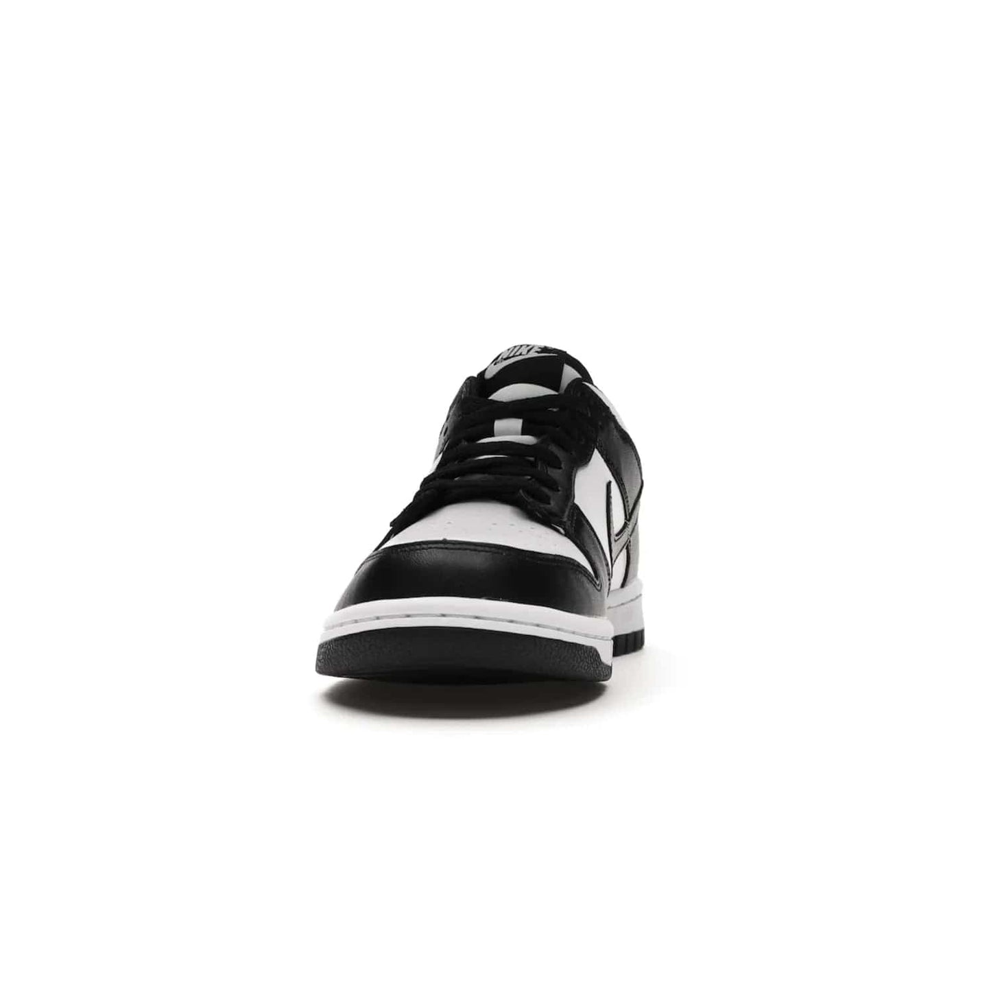Nike Dunk Low Retro White Black Panda (2021) (GS) - Image 11 - Only at www.BallersClubKickz.com - Upgrade your style with the Nike Dunk Low Retro White Black (GS). Featuring premium leather, iconic Nike text, signature Swoosh logo and striking black/white colorway, this striking silhouette is the perfect mix of style and comfort. Colorway released in March 2021.