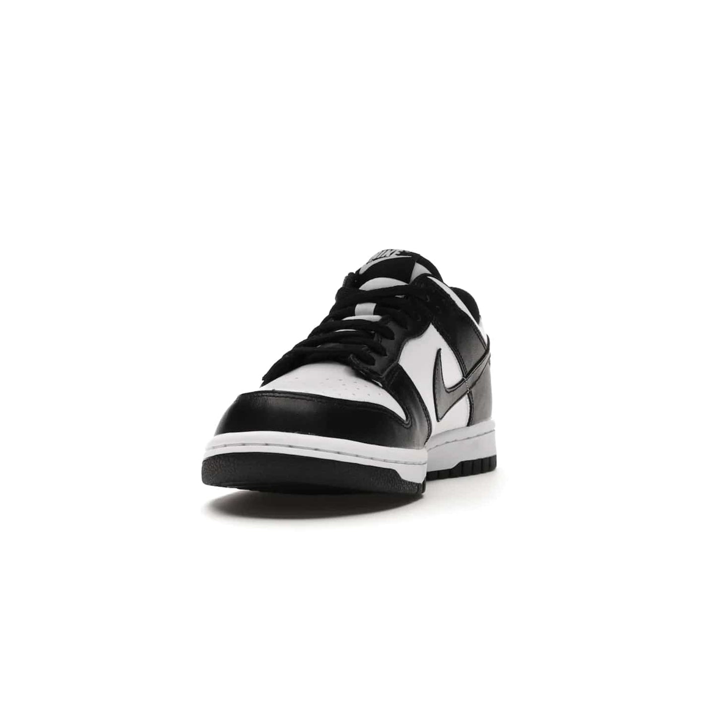 Nike Dunk Low Retro White Black Panda (2021) (GS) - Image 12 - Only at www.BallersClubKickz.com - Upgrade your style with the Nike Dunk Low Retro White Black (GS). Featuring premium leather, iconic Nike text, signature Swoosh logo and striking black/white colorway, this striking silhouette is the perfect mix of style and comfort. Colorway released in March 2021.