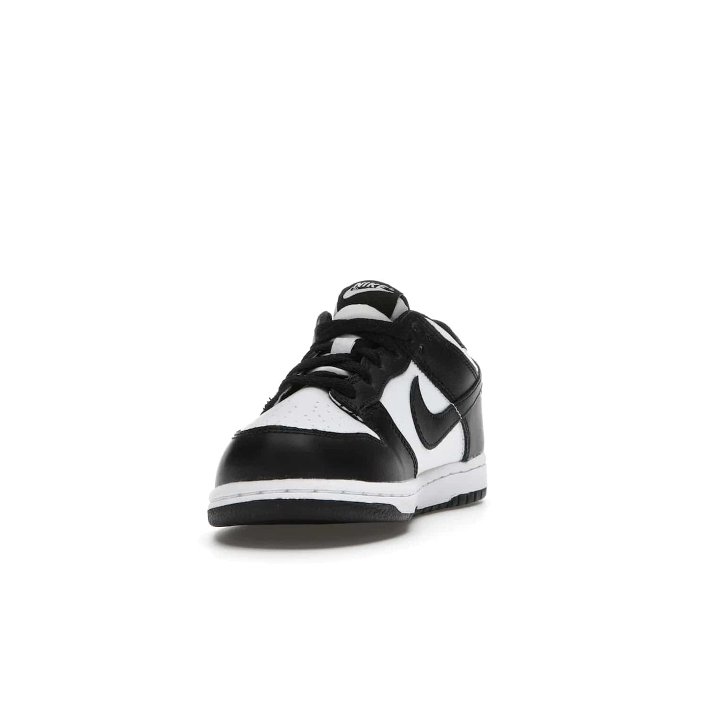 Nike Dunk Low Retro White Black Panda (2021) (PS) - Image 12 - Only at www.BallersClubKickz.com - Retro basketball style with modern updates: Nike Dunk Low PS White/Black. Find the classic sneaker with all-white leather upper, black overlays, black Swoosh branding an more. Originally released in March 2021.