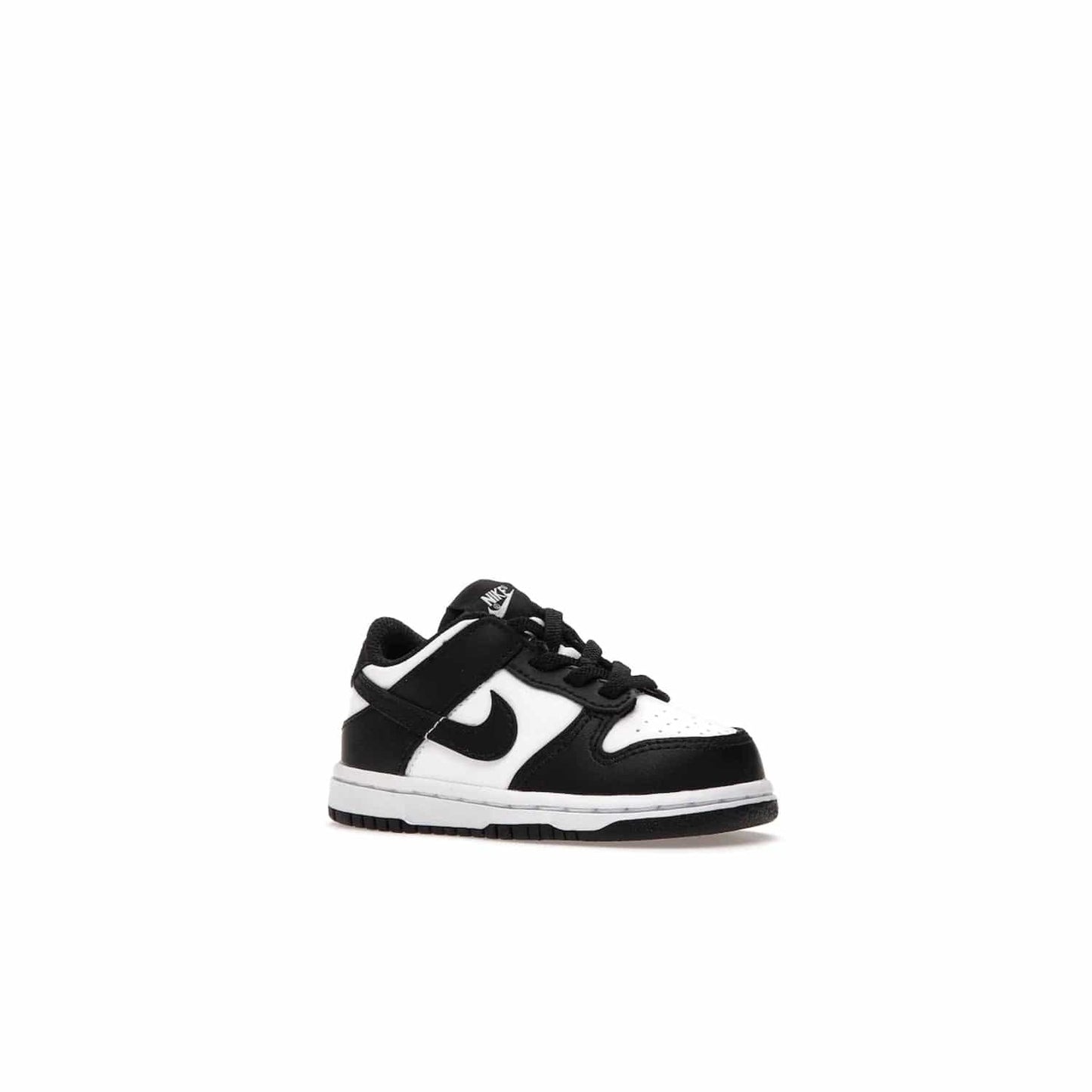 Nike Dunk Low Retro White Black Panda (2021) (TD) - Image 4 - Only at www.BallersClubKickz.com - The perfect blend of classic style and modern style, the Nike Dunk Low Retro White Black (TD) toddler shoe has a soft leather upper, white midsole, and black outsole. Signature Swoosh branding and lightly padded tongue give it timeless Nike style. Released in March 2021.