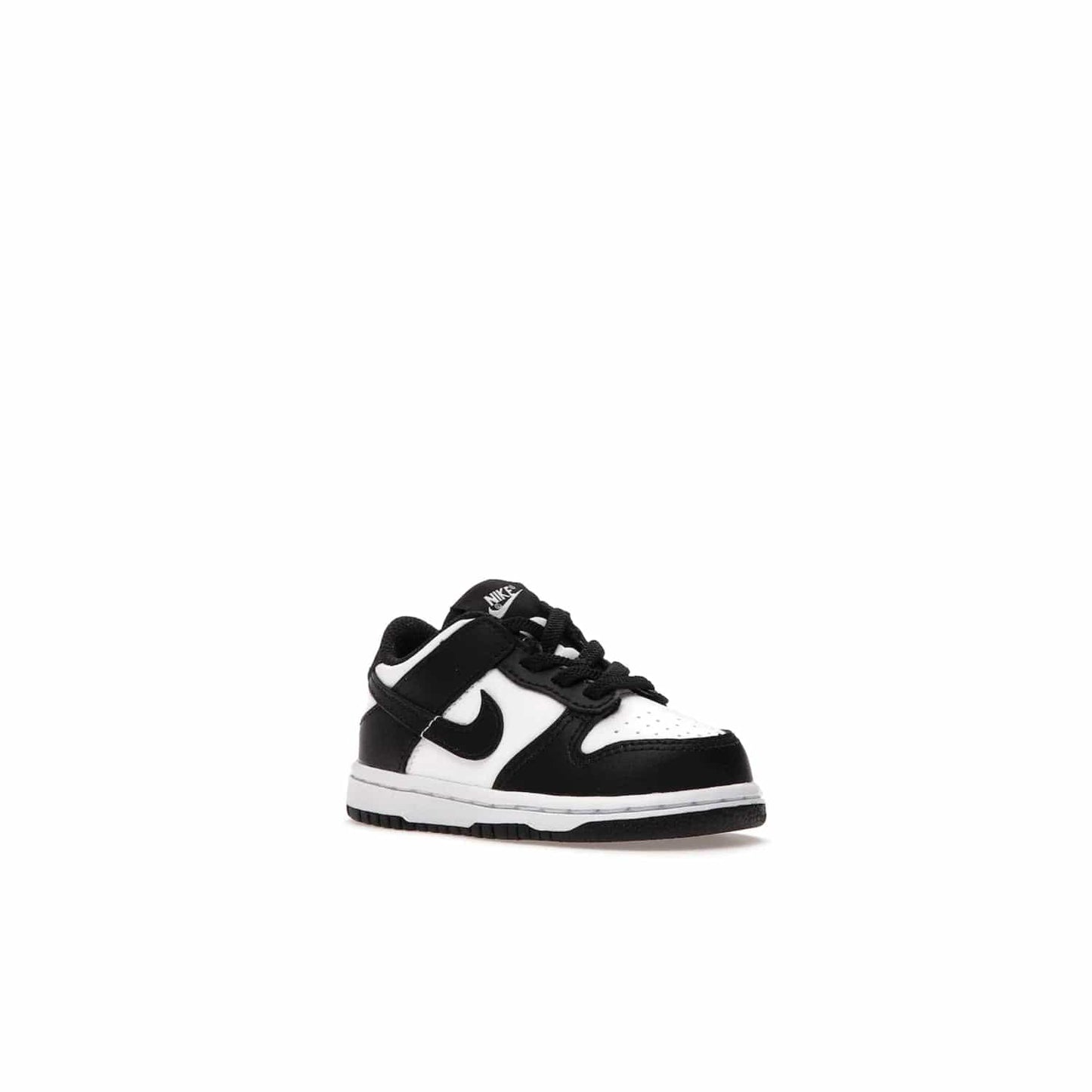 Nike Dunk Low Retro White Black Panda (2021) (TD) - Image 5 - Only at www.BallersClubKickz.com - The perfect blend of classic style and modern style, the Nike Dunk Low Retro White Black (TD) toddler shoe has a soft leather upper, white midsole, and black outsole. Signature Swoosh branding and lightly padded tongue give it timeless Nike style. Released in March 2021.