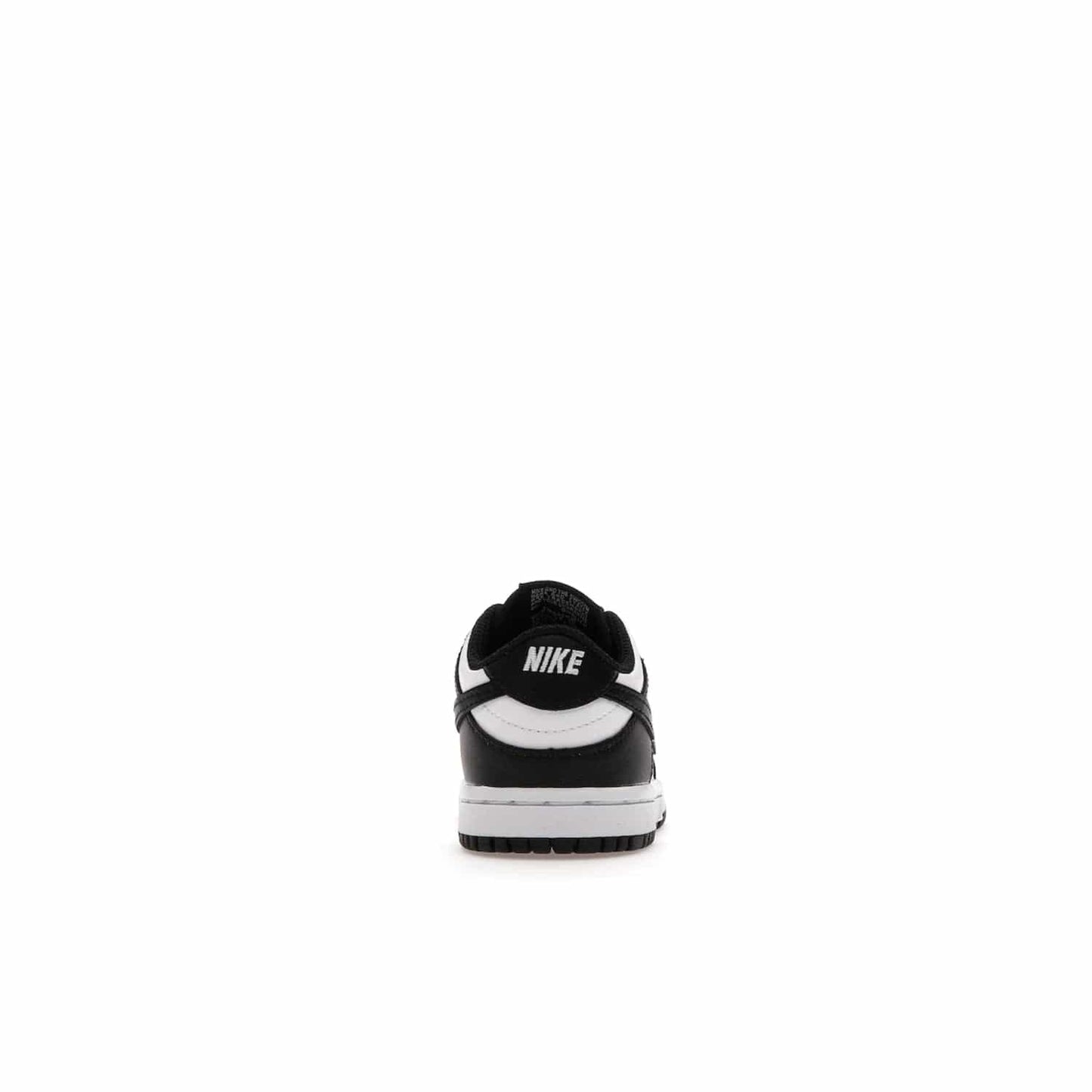 Nike Dunk Low Retro White Black Panda (2021) (TD) - Image 28 - Only at www.BallersClubKickz.com - The perfect blend of classic style and modern style, the Nike Dunk Low Retro White Black (TD) toddler shoe has a soft leather upper, white midsole, and black outsole. Signature Swoosh branding and lightly padded tongue give it timeless Nike style. Released in March 2021.