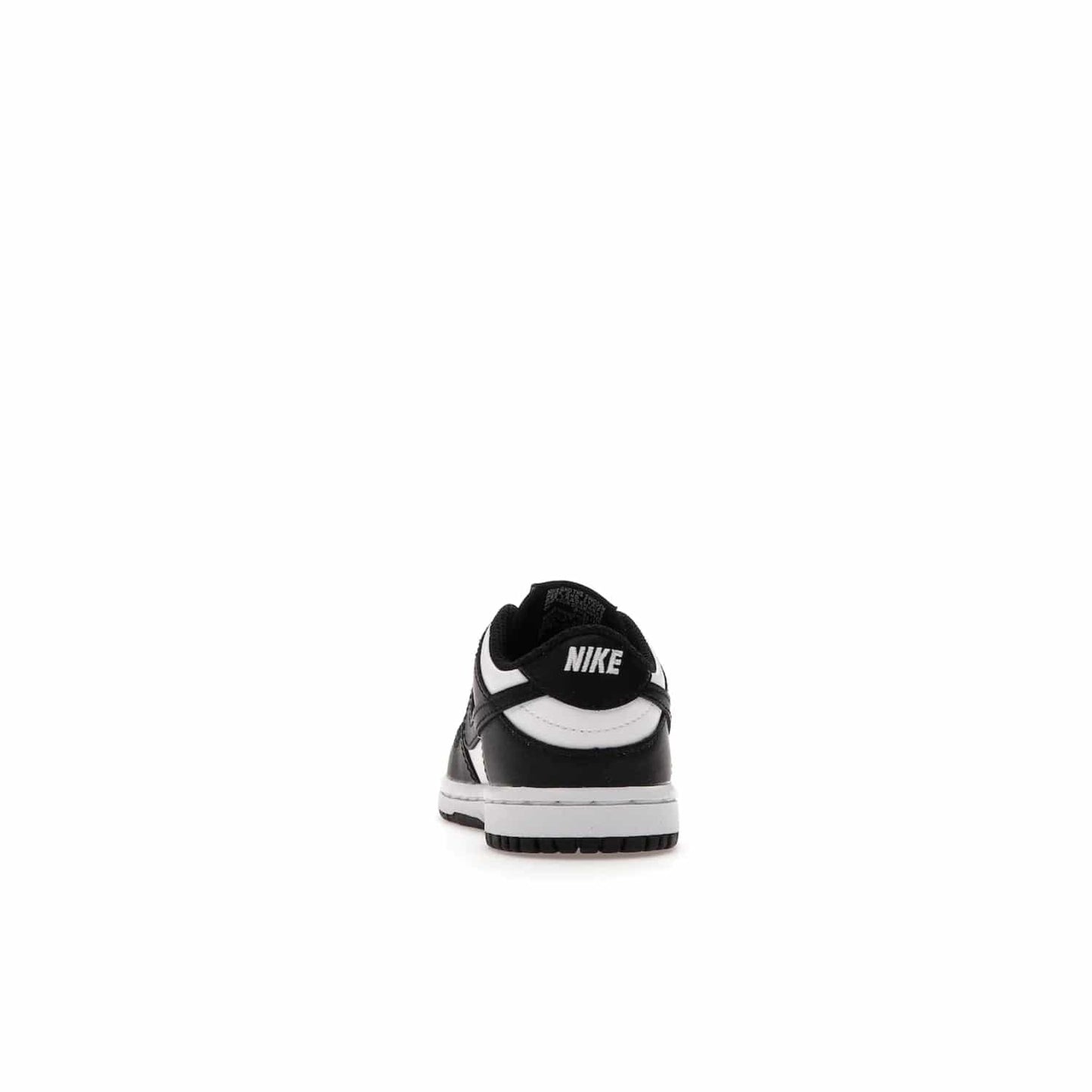 Nike Dunk Low Retro White Black Panda (2021) (TD) - Image 27 - Only at www.BallersClubKickz.com - The perfect blend of classic style and modern style, the Nike Dunk Low Retro White Black (TD) toddler shoe has a soft leather upper, white midsole, and black outsole. Signature Swoosh branding and lightly padded tongue give it timeless Nike style. Released in March 2021.