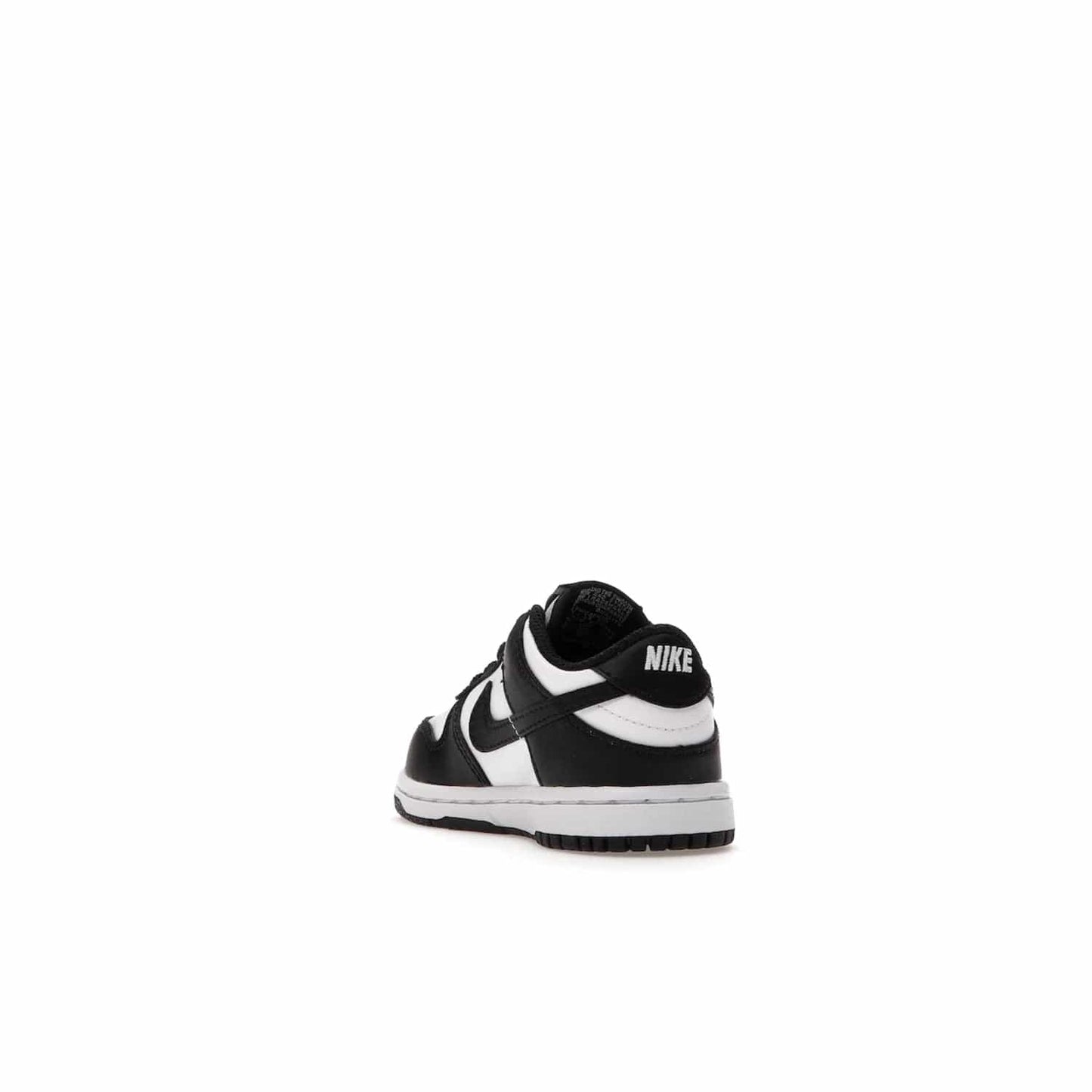 Nike Dunk Low Retro White Black Panda (2021) (TD) - Image 25 - Only at www.BallersClubKickz.com - The perfect blend of classic style and modern style, the Nike Dunk Low Retro White Black (TD) toddler shoe has a soft leather upper, white midsole, and black outsole. Signature Swoosh branding and lightly padded tongue give it timeless Nike style. Released in March 2021.