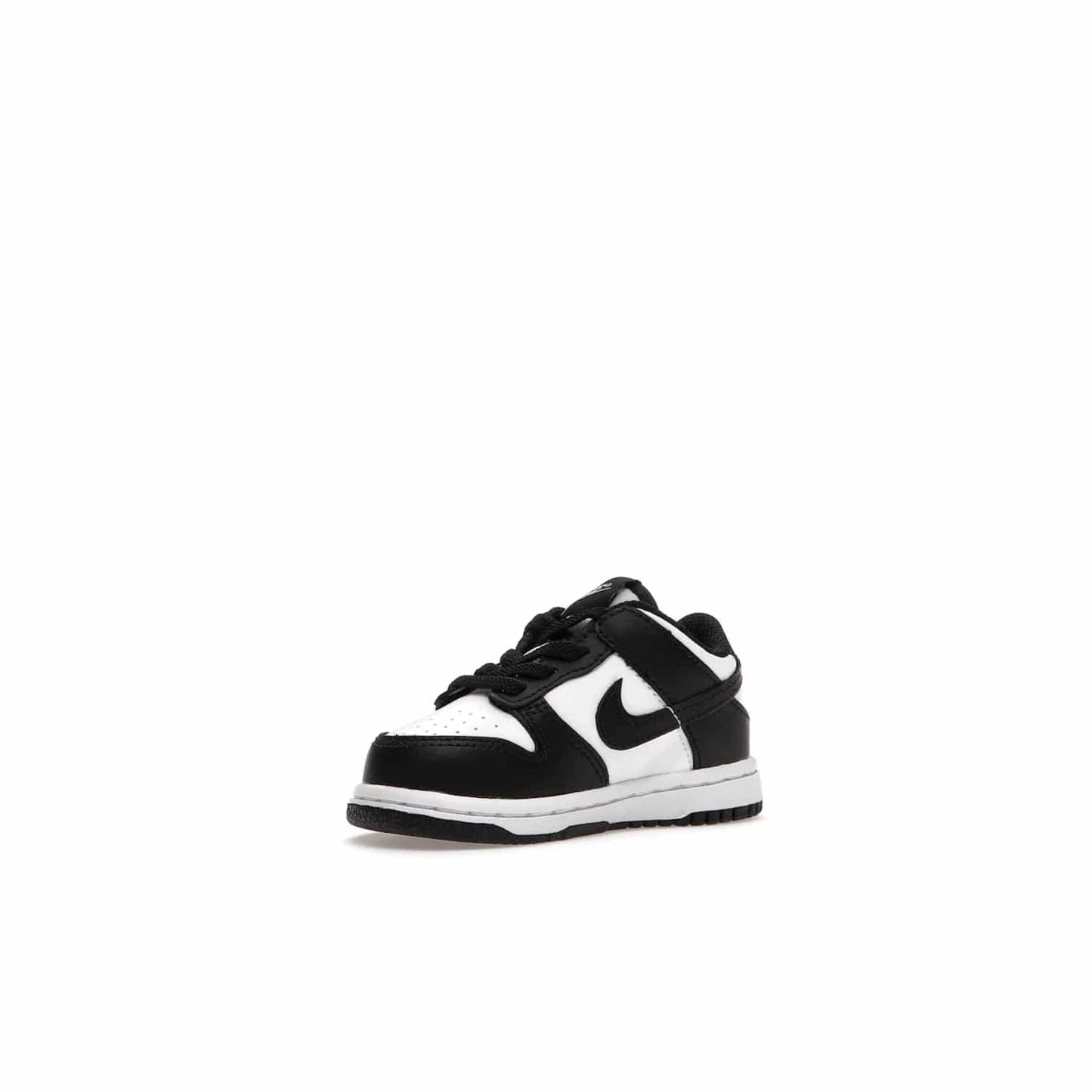 Nike Dunk Low Retro White Black Panda (2021) (TD) - Image 15 - Only at www.BallersClubKickz.com - The perfect blend of classic style and modern style, the Nike Dunk Low Retro White Black (TD) toddler shoe has a soft leather upper, white midsole, and black outsole. Signature Swoosh branding and lightly padded tongue give it timeless Nike style. Released in March 2021.