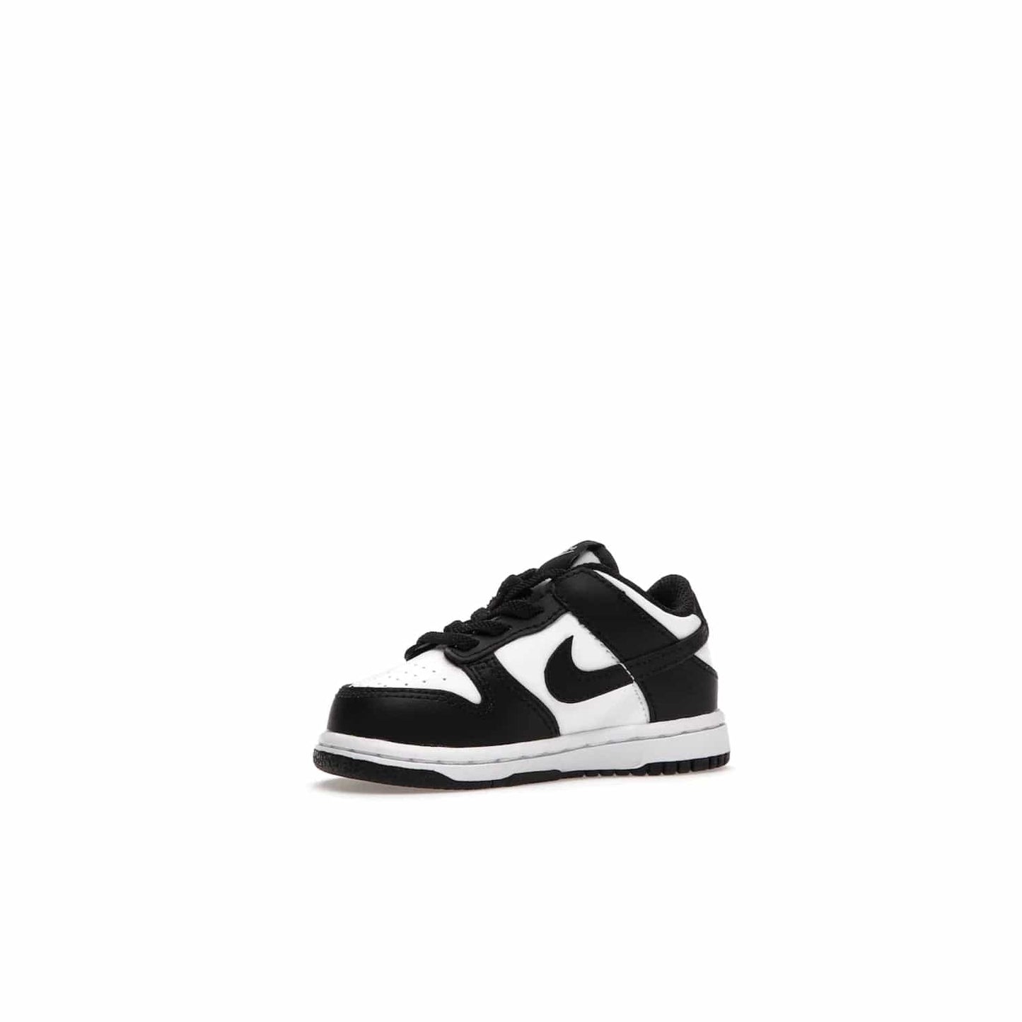 Nike Dunk Low Retro White Black Panda (2021) (TD) - Image 16 - Only at www.BallersClubKickz.com - The perfect blend of classic style and modern style, the Nike Dunk Low Retro White Black (TD) toddler shoe has a soft leather upper, white midsole, and black outsole. Signature Swoosh branding and lightly padded tongue give it timeless Nike style. Released in March 2021.
