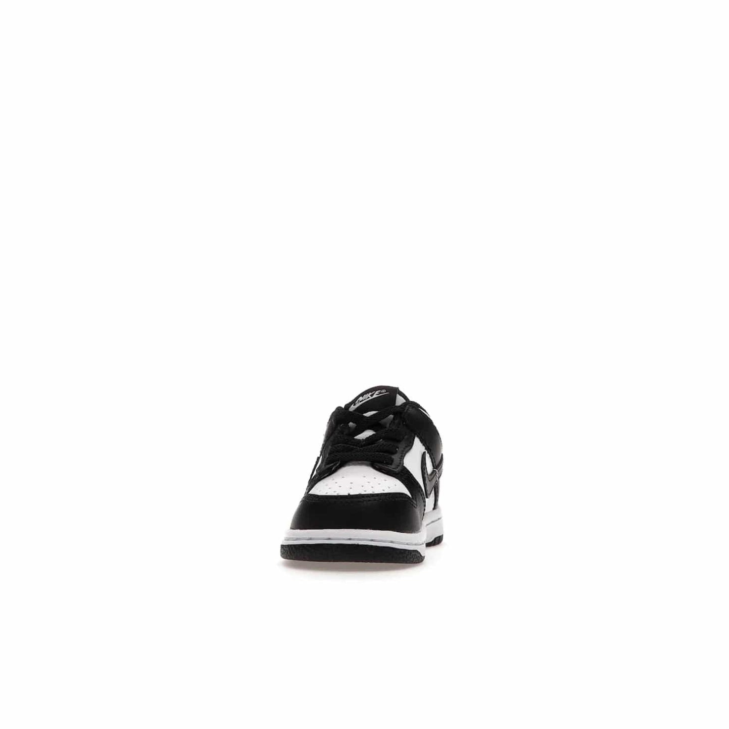 Nike Dunk Low Retro White Black Panda (2021) (TD) - Image 11 - Only at www.BallersClubKickz.com - The perfect blend of classic style and modern style, the Nike Dunk Low Retro White Black (TD) toddler shoe has a soft leather upper, white midsole, and black outsole. Signature Swoosh branding and lightly padded tongue give it timeless Nike style. Released in March 2021.