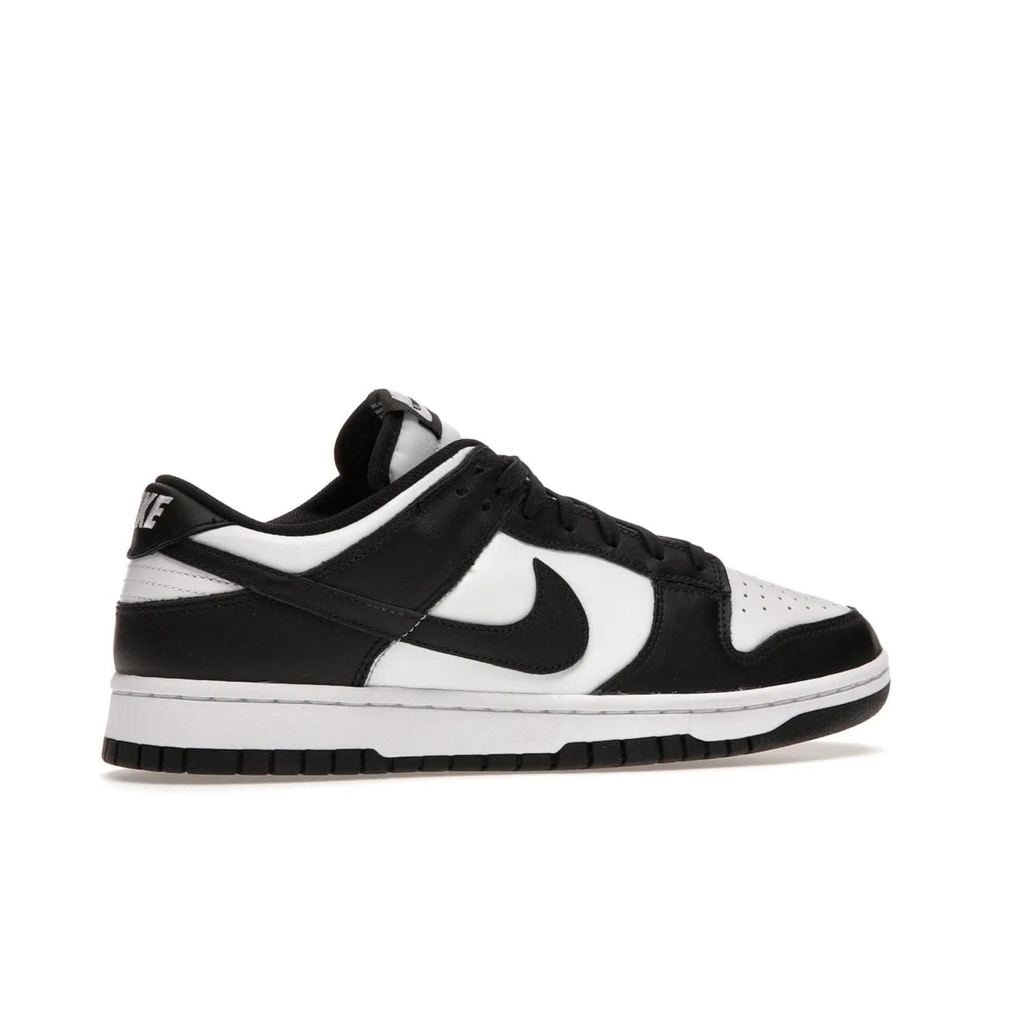 Nike Dunk Low Retro White Black Panda (2021) - Image 35 - Only at www.BallersClubKickz.com - Shop the Nike Dunk Low Retro White Black for classic styling featuring white leather with black leather overlays and classic Nike branding. Released in 2021, this timeless design offers a white midsole and black outsole for a stylish look. Shop all the Nike Dunks & rock this classic look.