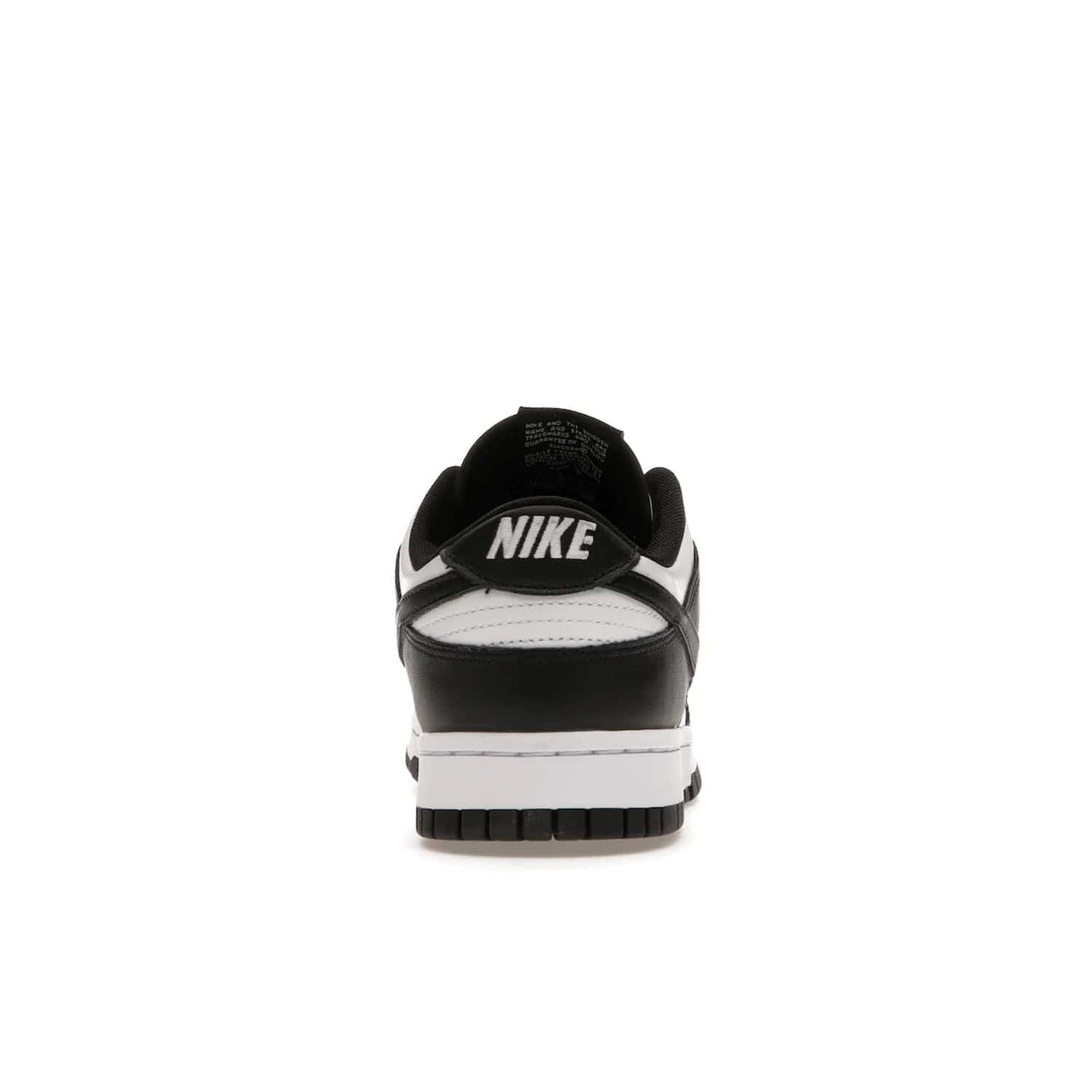 Nike Dunk Low Retro White Black Panda (2021) - Image 28 - Only at www.BallersClubKickz.com - Shop the Nike Dunk Low Retro White Black for classic styling featuring white leather with black leather overlays and classic Nike branding. Released in 2021, this timeless design offers a white midsole and black outsole for a stylish look. Shop all the Nike Dunks & rock this classic look.