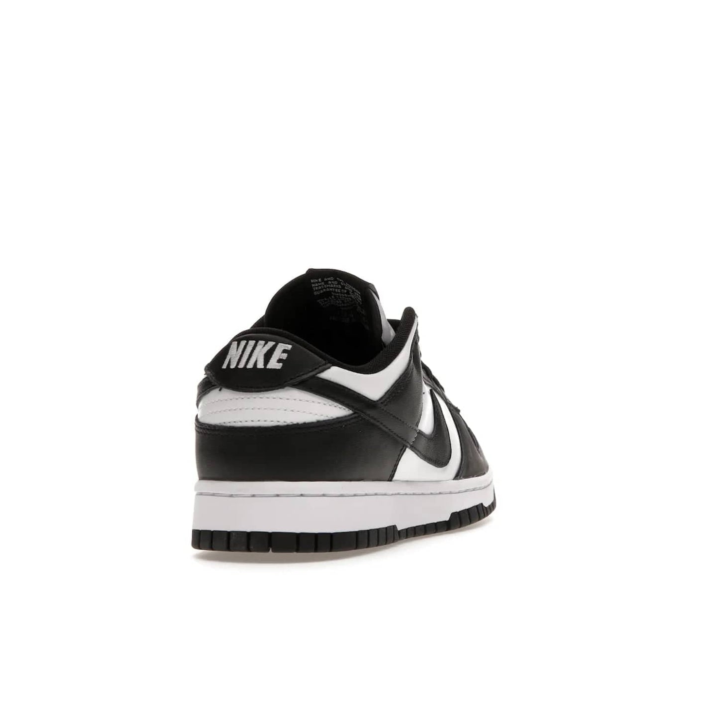 Nike Dunk Low Retro White Black Panda (2021) - Image 30 - Only at www.BallersClubKickz.com - Shop the Nike Dunk Low Retro White Black for classic styling featuring white leather with black leather overlays and classic Nike branding. Released in 2021, this timeless design offers a white midsole and black outsole for a stylish look. Shop all the Nike Dunks & rock this classic look.