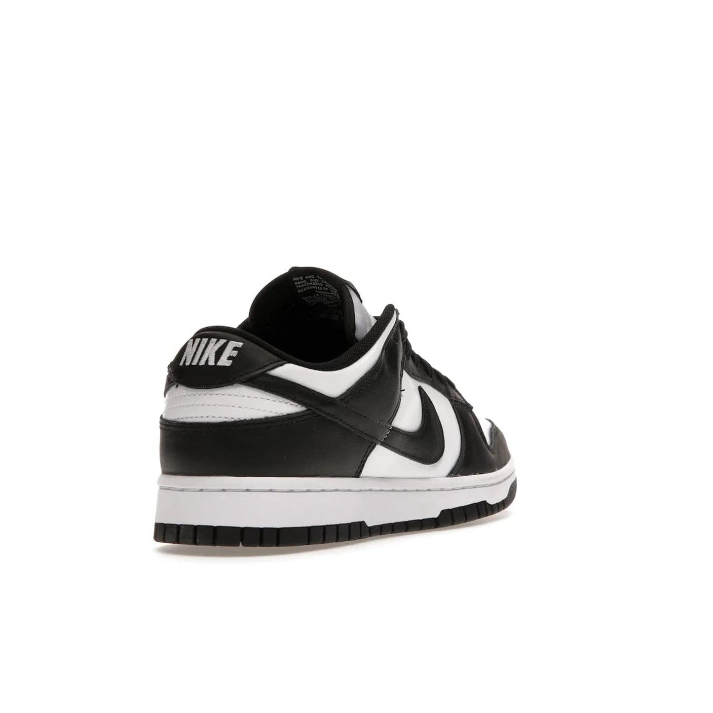 Nike Dunk Low Retro White Black Panda (2021) - Image 31 - Only at www.BallersClubKickz.com - Shop the Nike Dunk Low Retro White Black for classic styling featuring white leather with black leather overlays and classic Nike branding. Released in 2021, this timeless design offers a white midsole and black outsole for a stylish look. Shop all the Nike Dunks & rock this classic look.