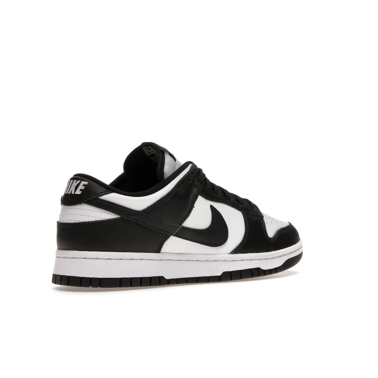 Nike Dunk Low Retro White Black Panda (2021) - Image 33 - Only at www.BallersClubKickz.com - Shop the Nike Dunk Low Retro White Black for classic styling featuring white leather with black leather overlays and classic Nike branding. Released in 2021, this timeless design offers a white midsole and black outsole for a stylish look. Shop all the Nike Dunks & rock this classic look.